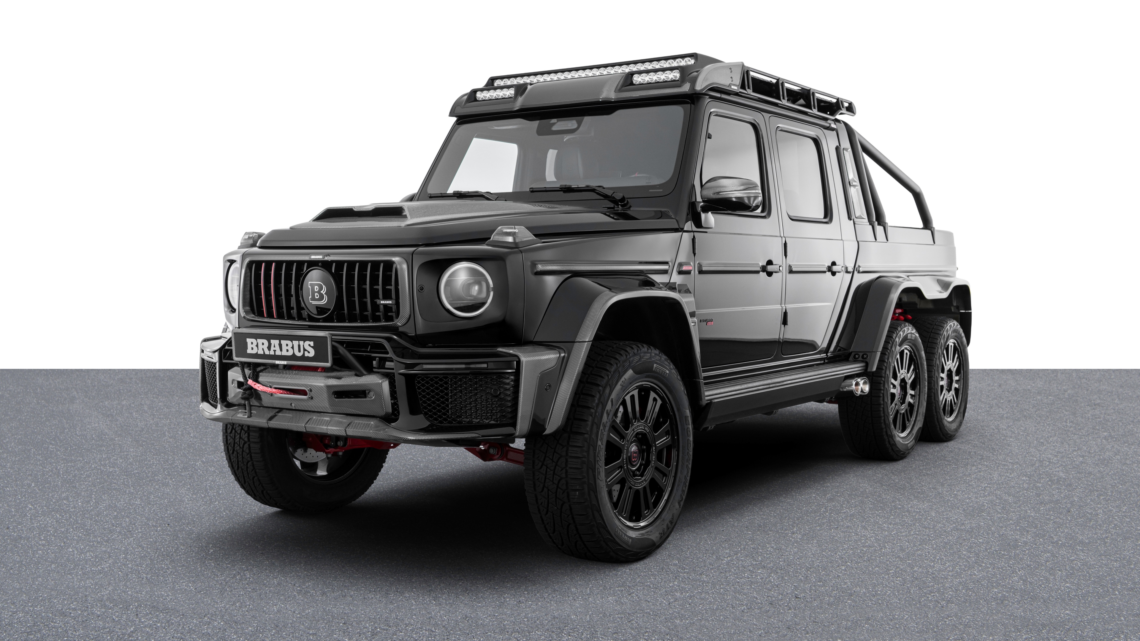 A high-contrast black and white photograph of the 2025 Mercedes-AMG G 63, showcasing its iconic rugged design and luxury features.
