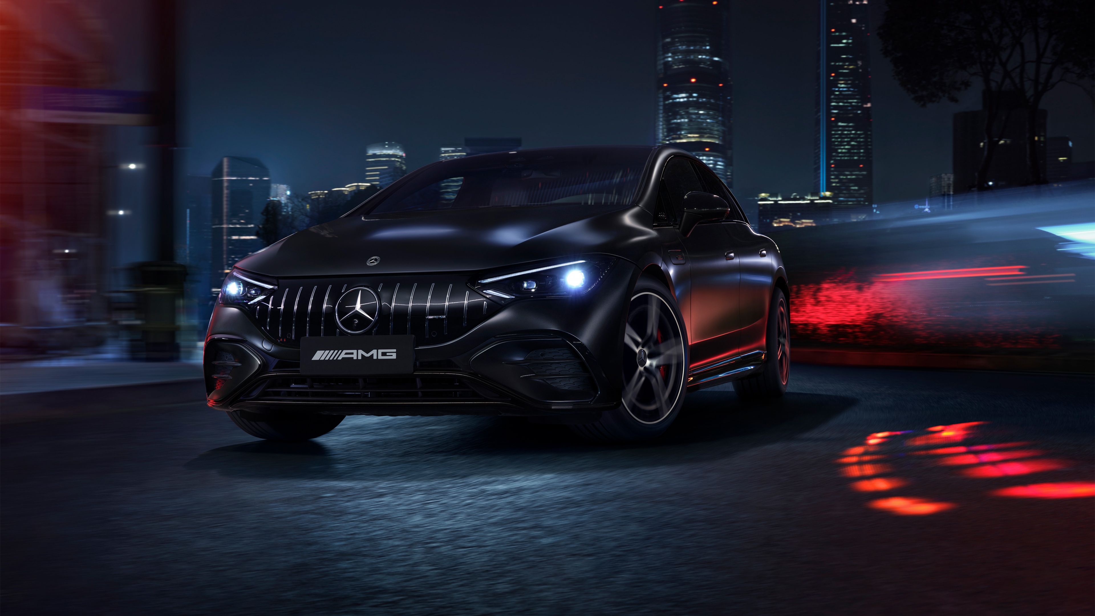 A sleek, black 2025 Mercedes-Benz AMG electric car with futuristic design elements.