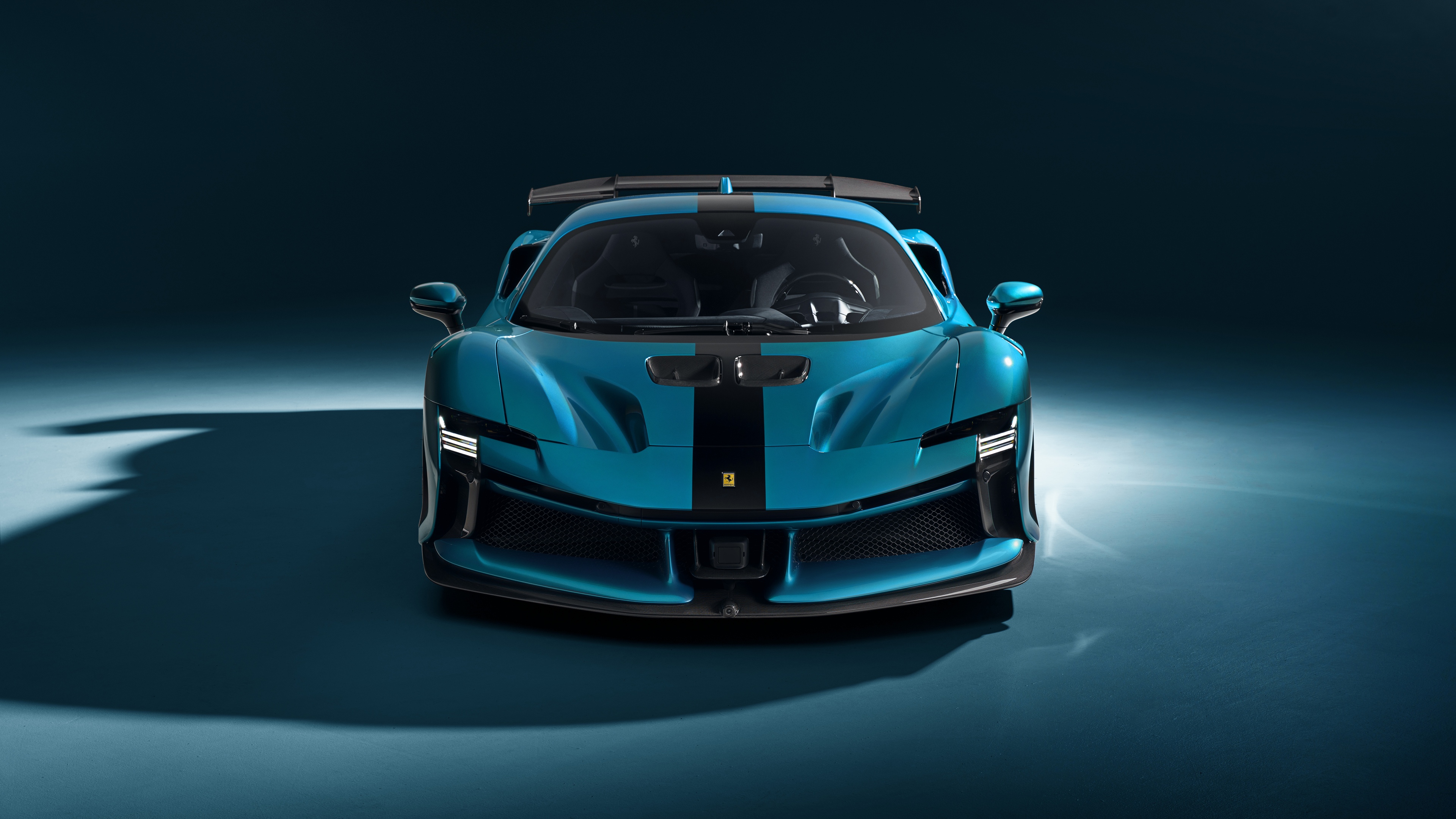 A high-resolution view of a blue Novitec Ferrari SF90 XX Stradale supercar with a modern blue aesthetic.