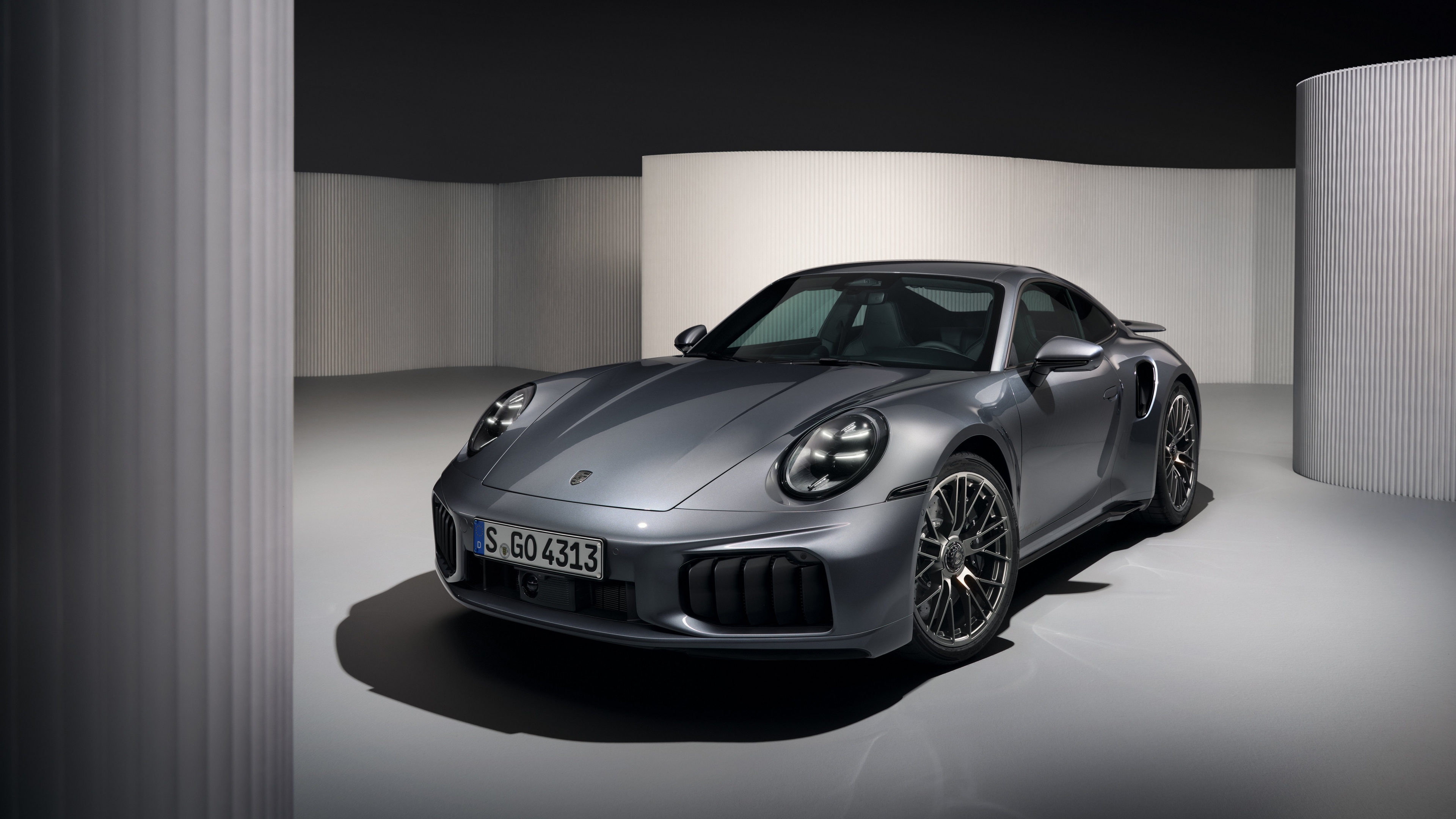 A high-resolution 5K view of the sleek 2025 Porsche 911 Turbo S sports car.
