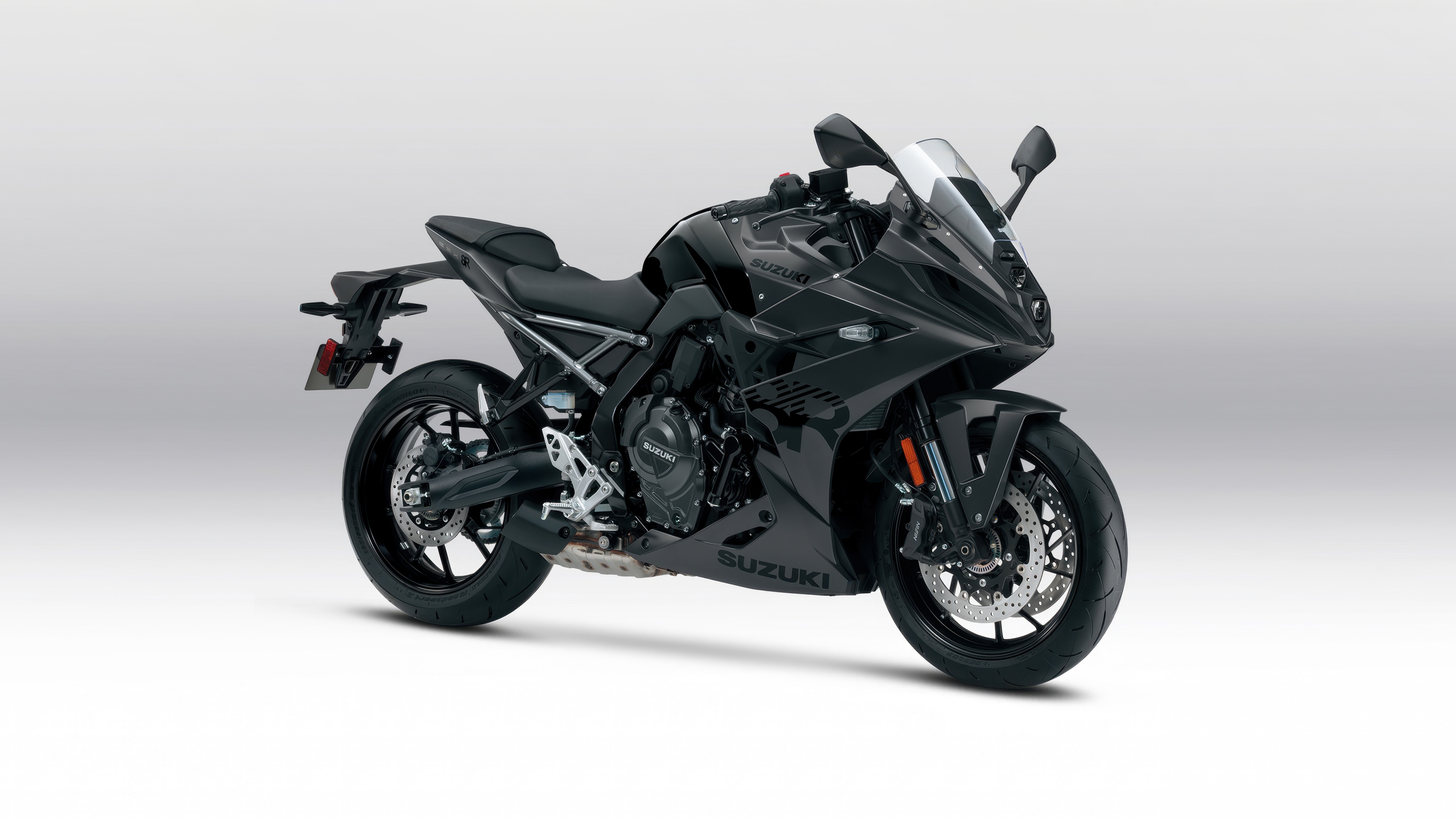 A sharp, detailed shot of the 2025 Suzuki GSX-8R sports motorcycle featuring an aerodynamic design and metallic finish.