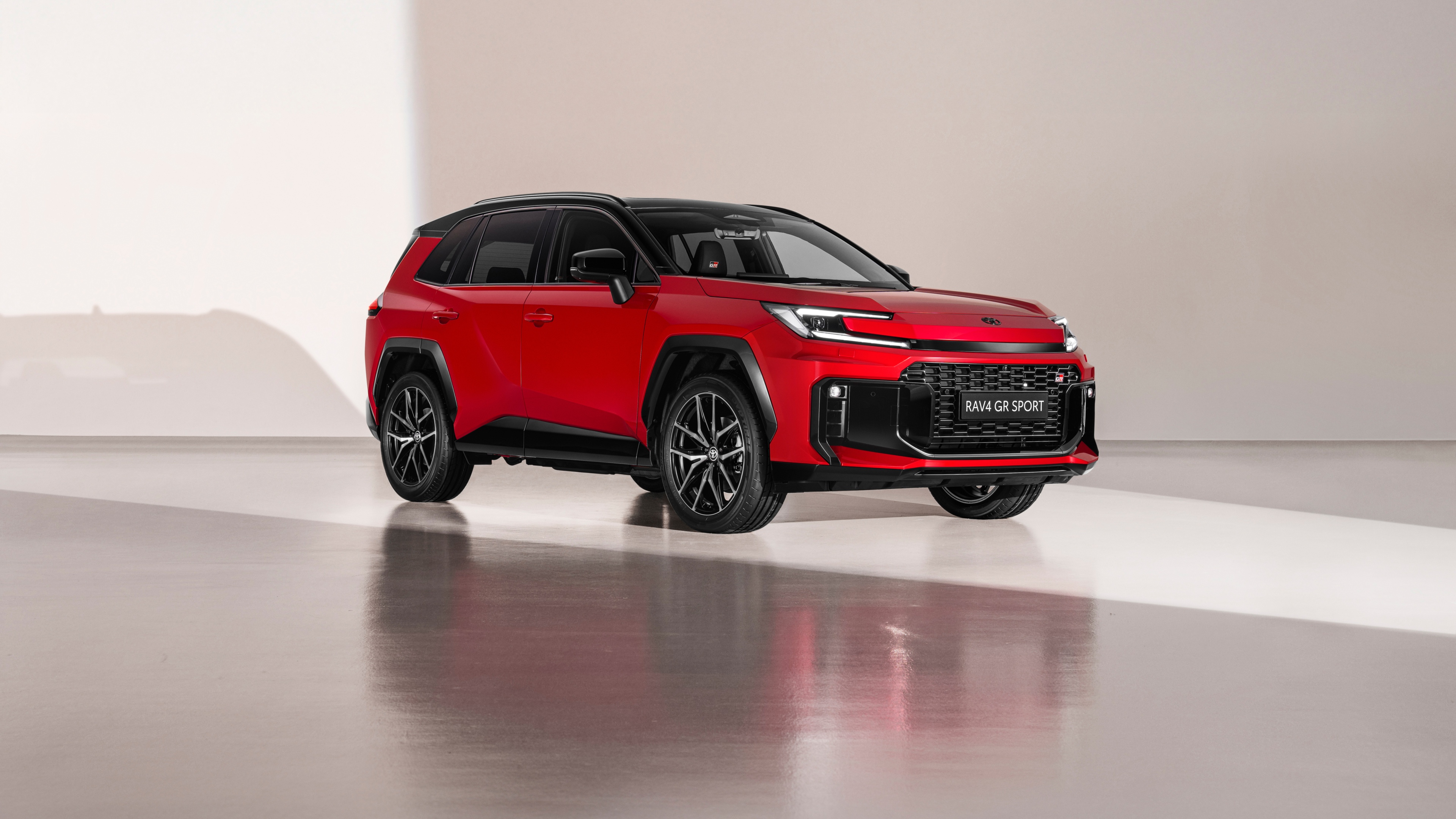 A highly detailed, high-quality shot of the 2025 Toyota RAV4 PHEV GR Sport plug-in hybrid SUV.