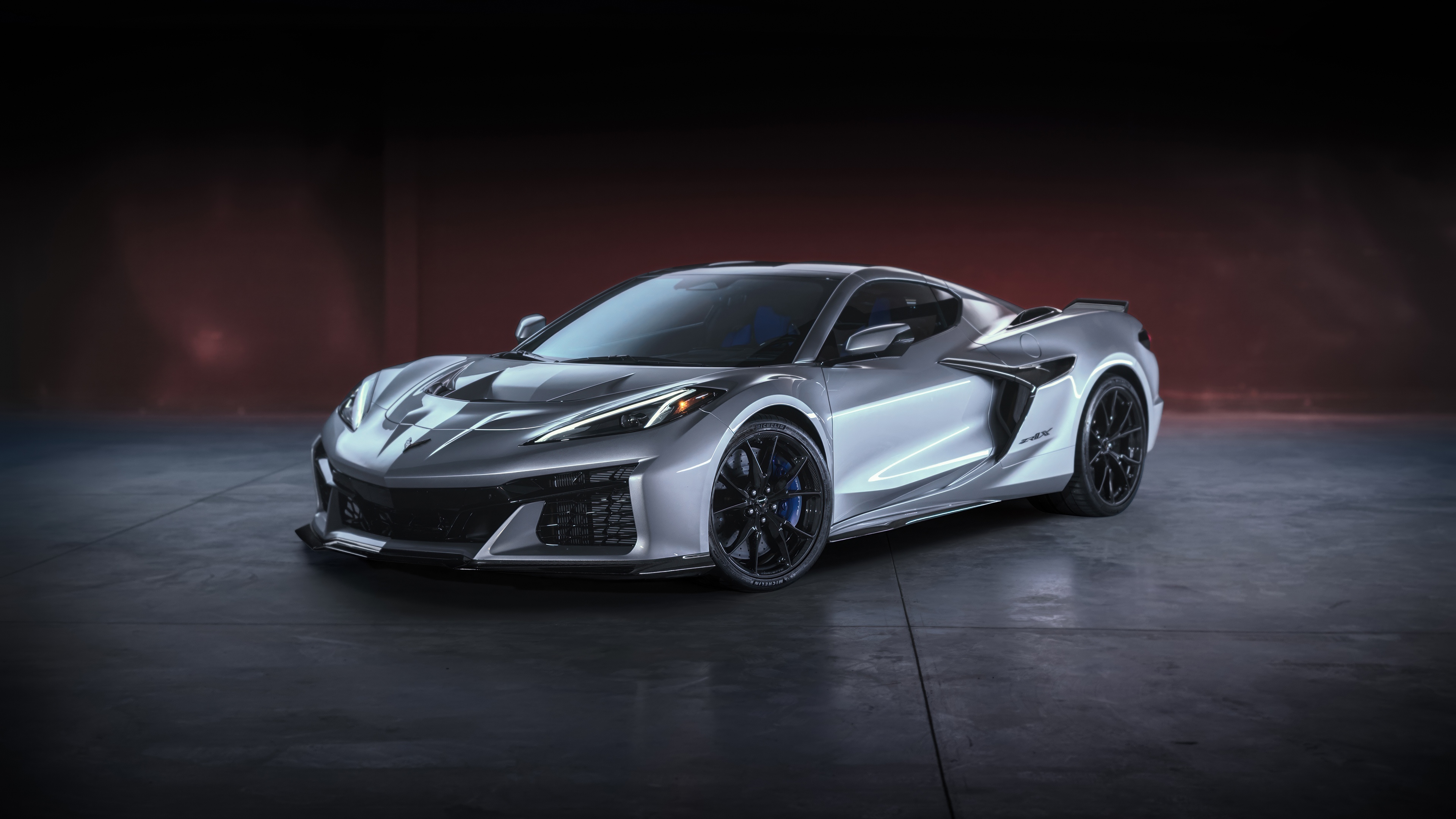 A futuristic 2026 Chevrolet Corvette ZR1X supercar featuring aerodynamic bodywork and a sleek, high-performance design.