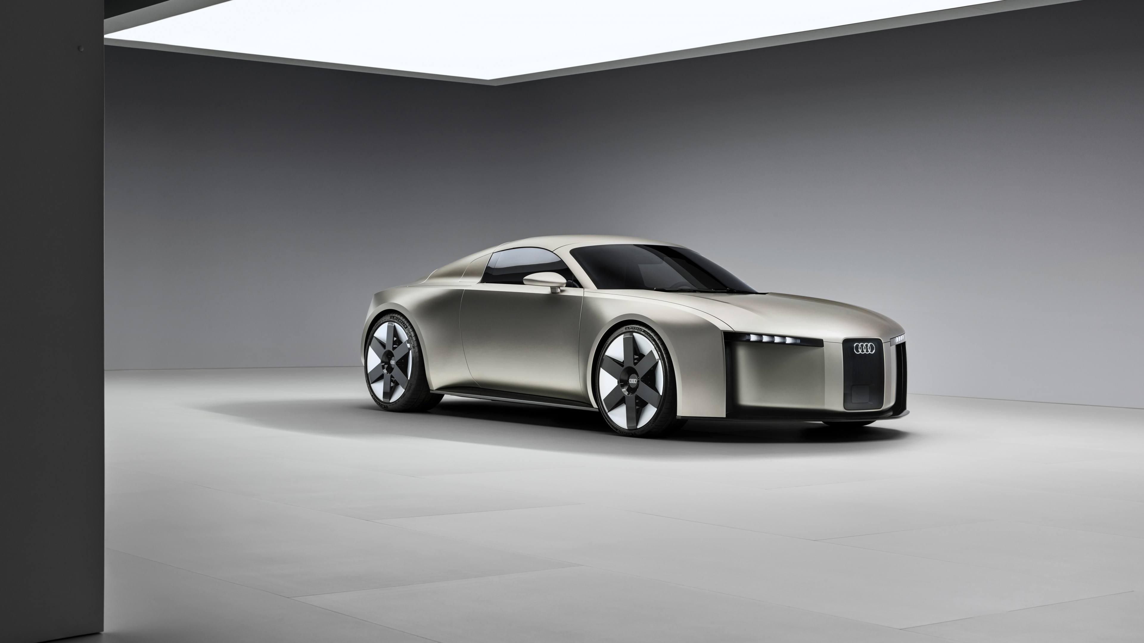 A sleek and futuristic Audi Concept C electric sports car featuring aerodynamic lines and a modern design.
