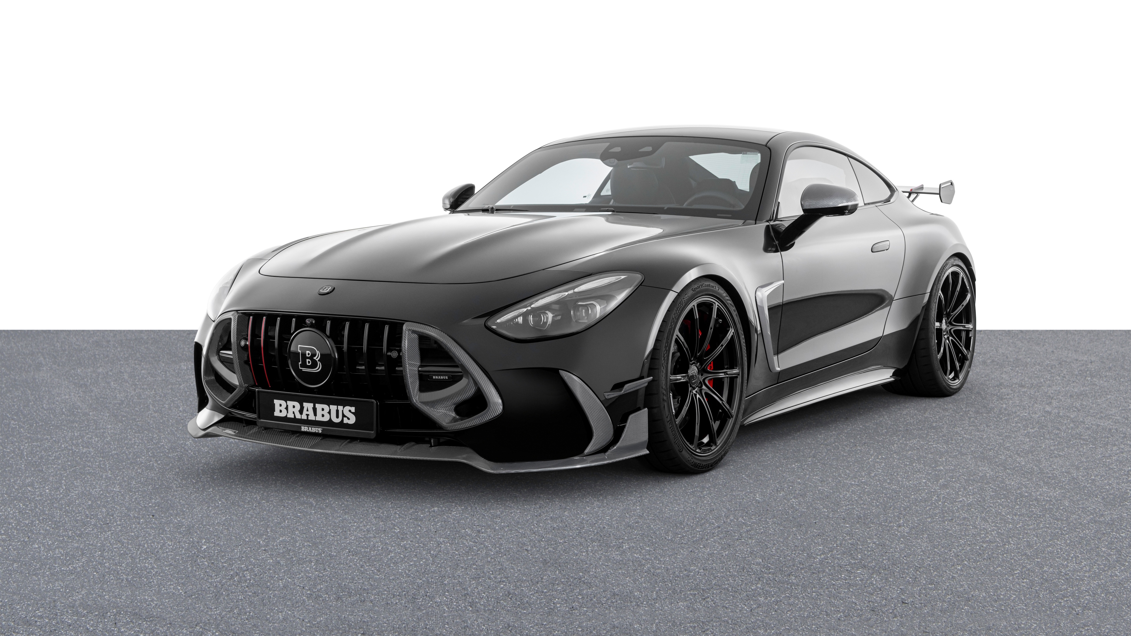 A high-contrast black and white shot of a Brabus 1000 Mercedes-AMG S 63 E Performance luxury sedan.