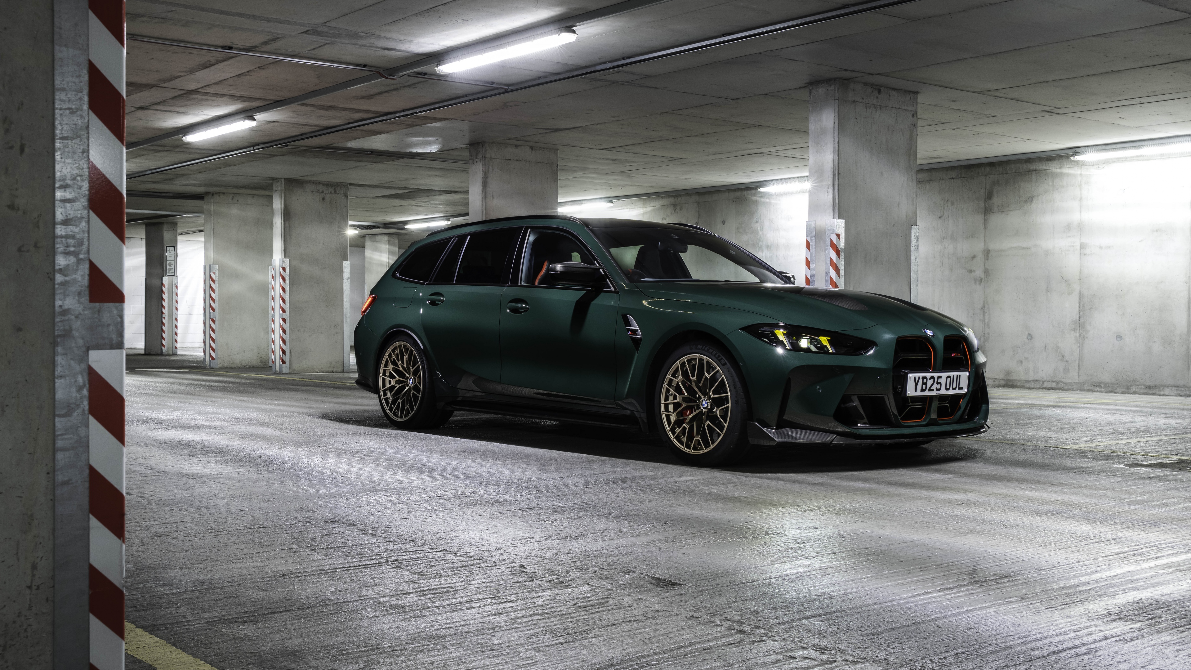 A cinematic view of a dark green illuminated parking garage with a moody atmosphere.