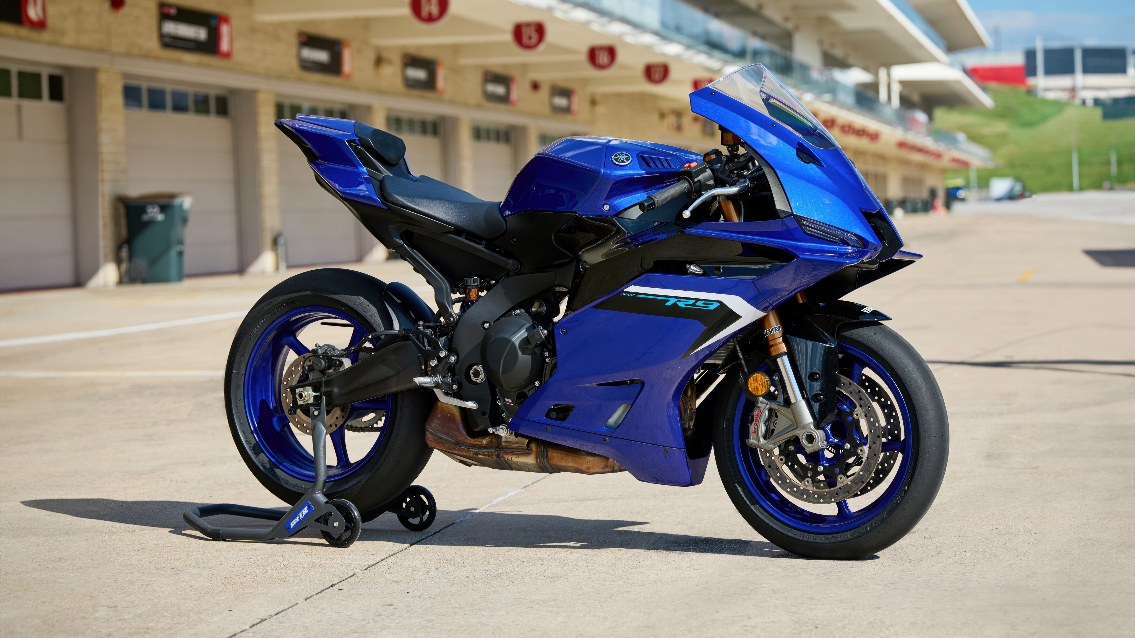 A high-tech 2025 sports bike with aerodynamic fairings and neon accents.