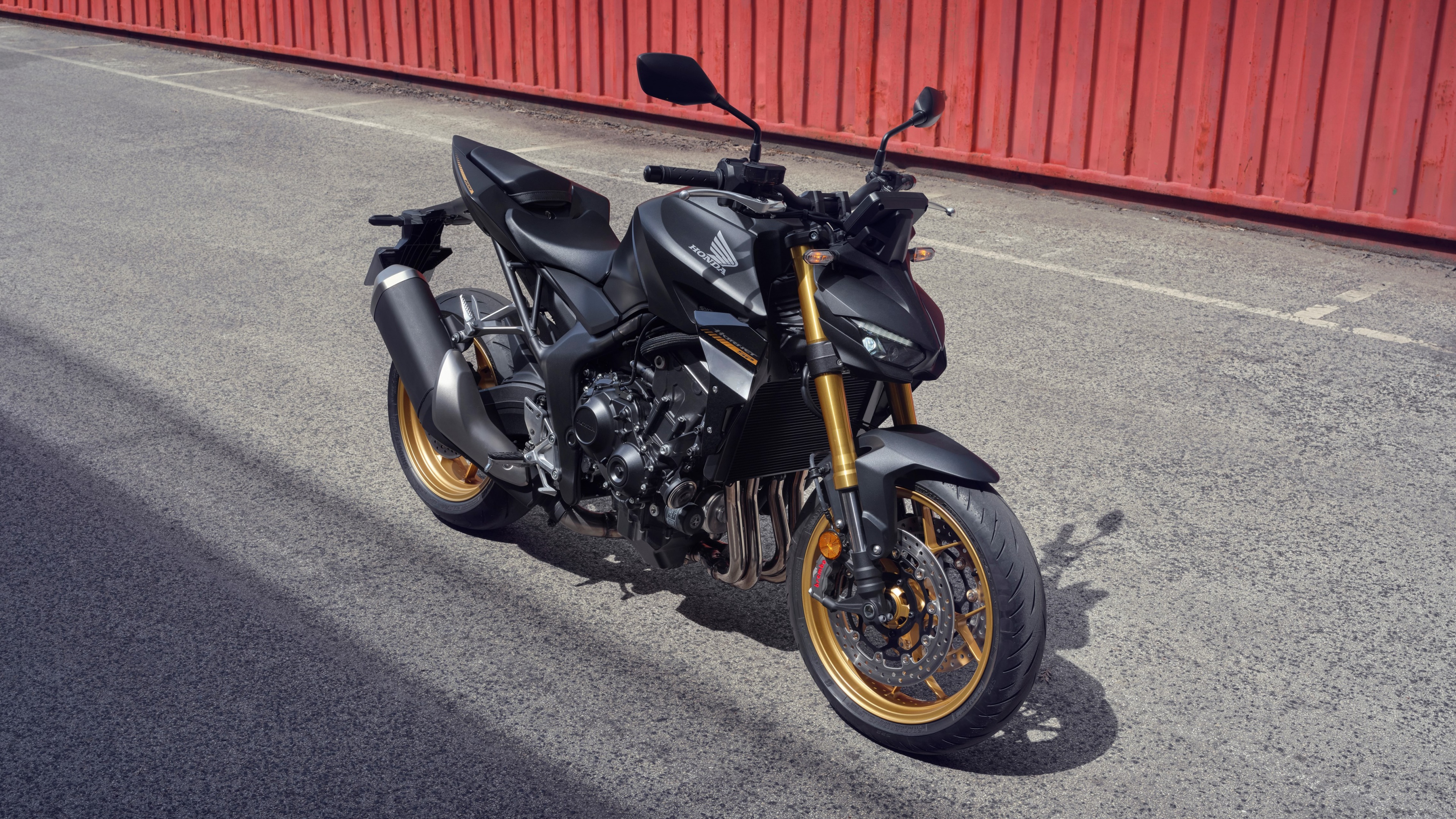 A high-performance 2025 streetfighter motorcycle with aggressive styling and futuristic design elements set in a modern urban environment.