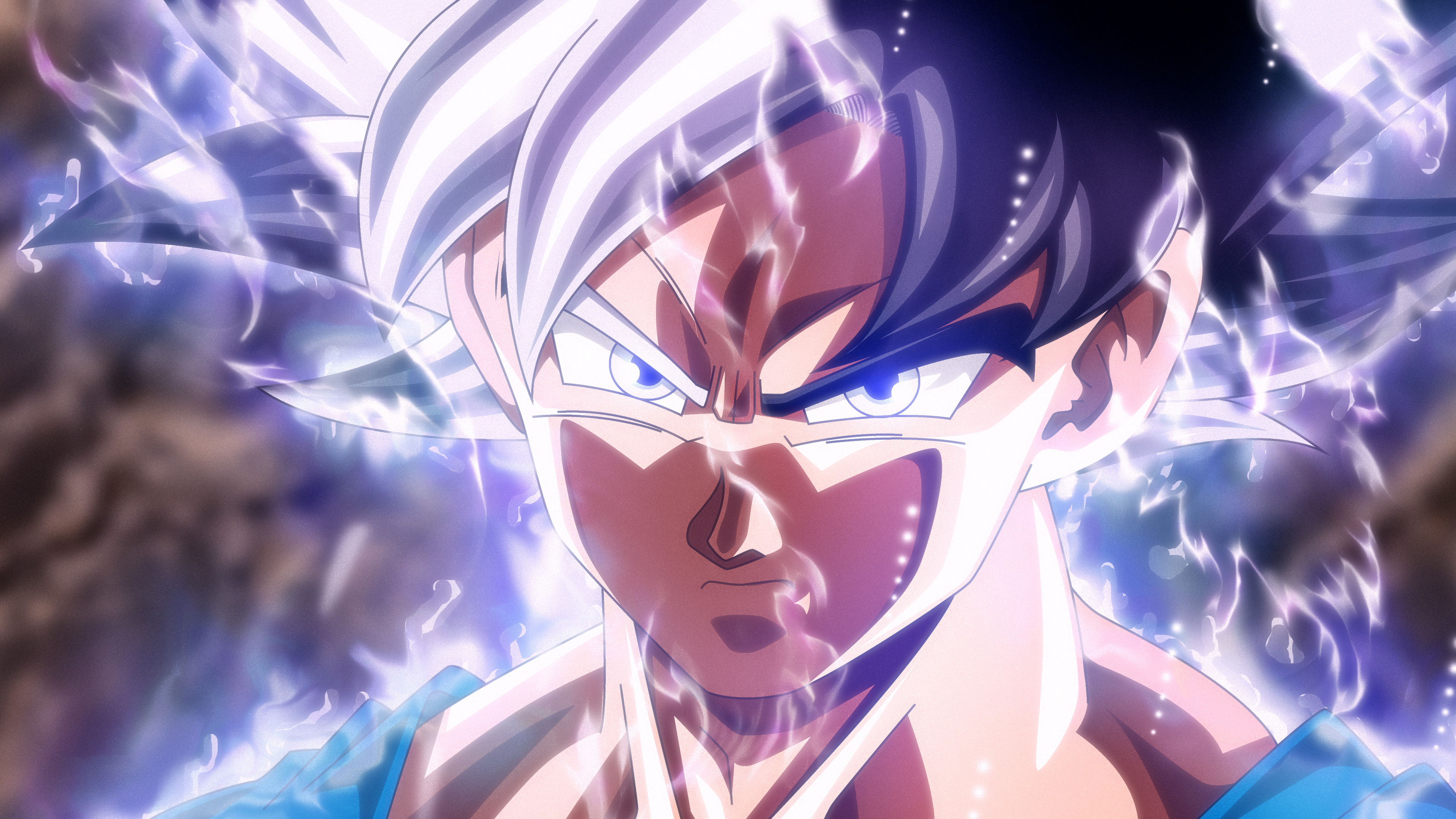 Goku in his Ultra Instinct Omen form from Dragon Ball Super with a glowing aura and intense gaze.