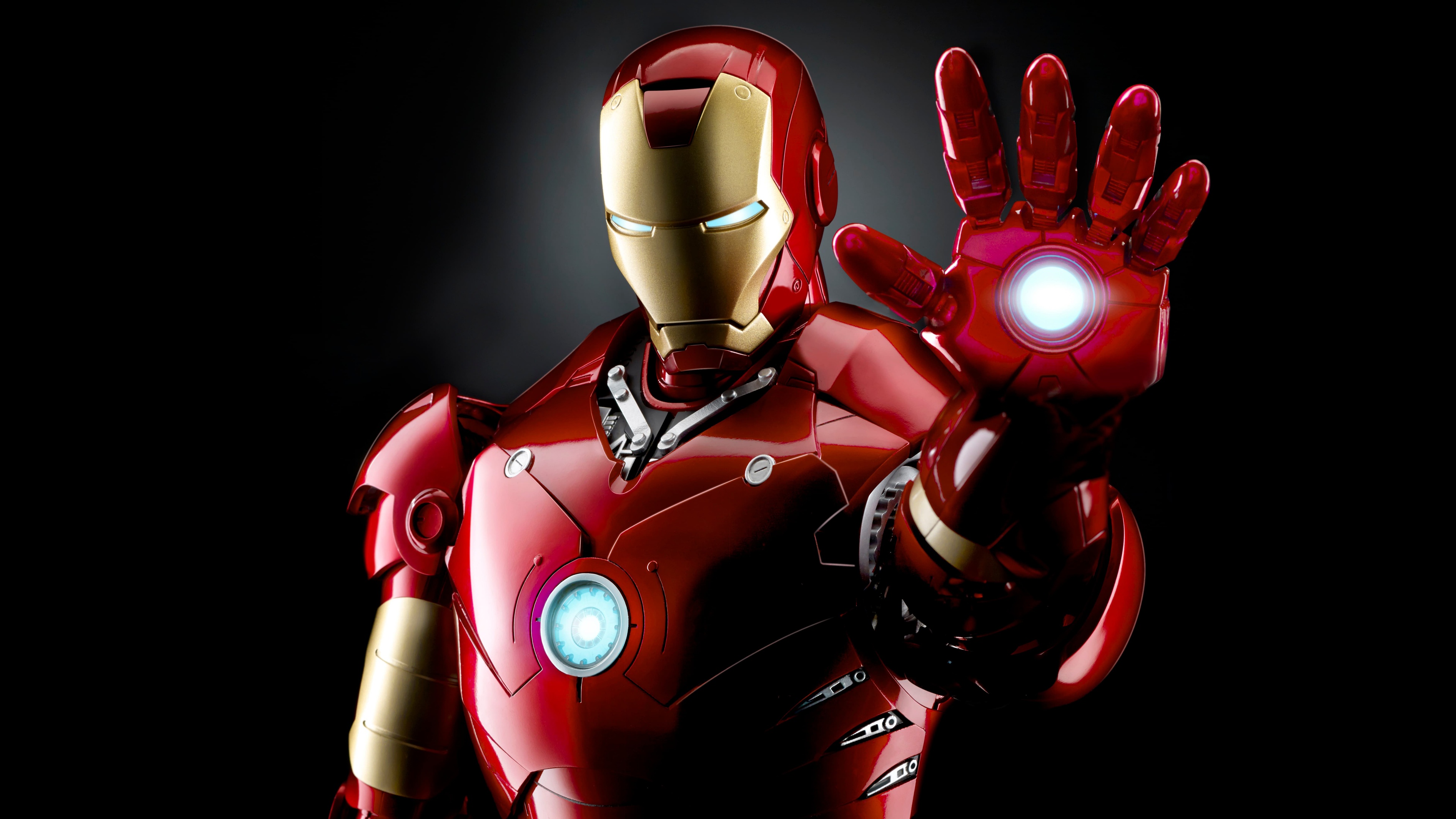 Cinematic close-up of Iron Man's metallic armor with glowing lights against a dark, dramatic background.