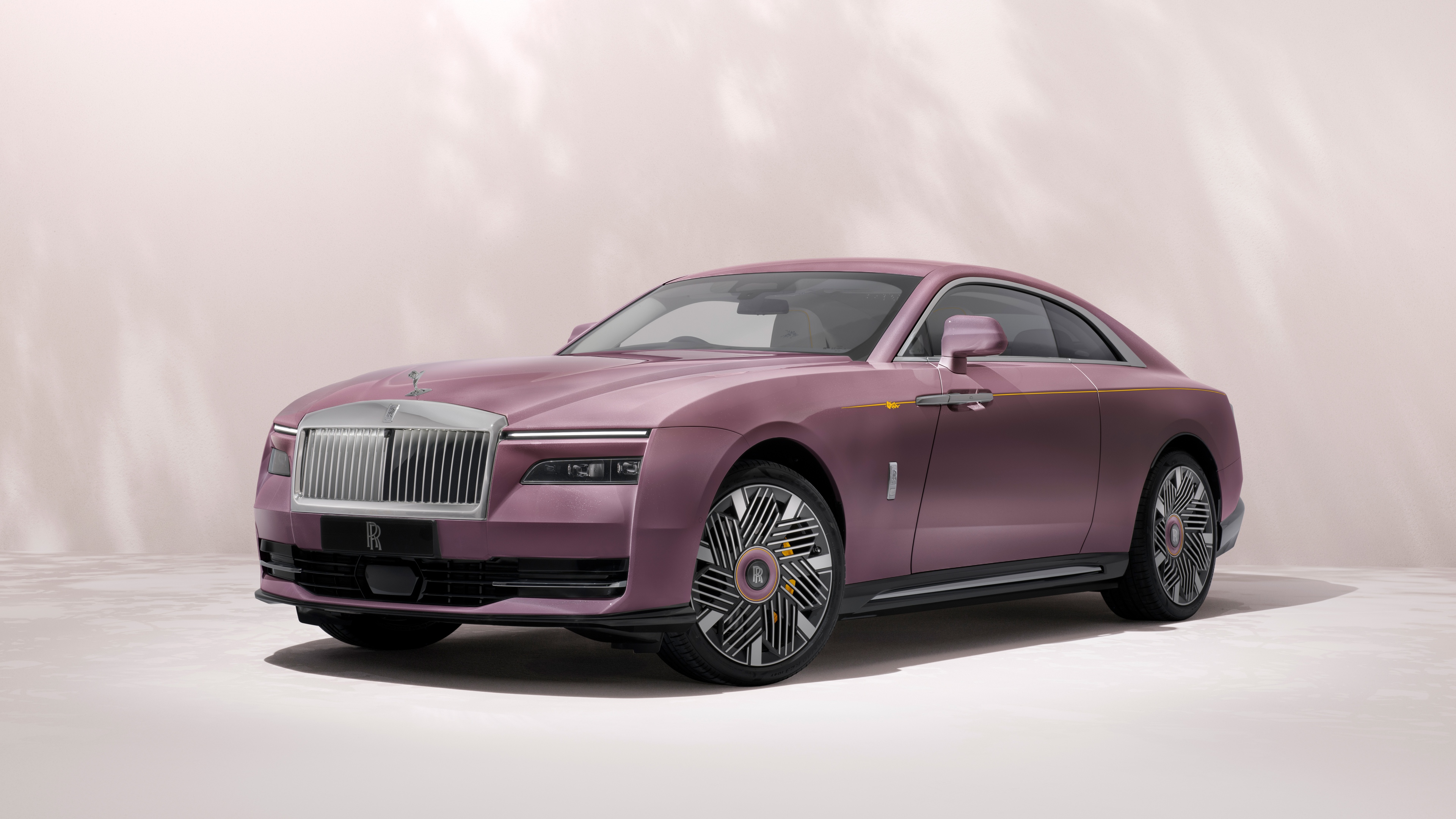A high-resolution, detailed close-up of the sleek and modern Rolls-Royce Spectre electric luxury car.