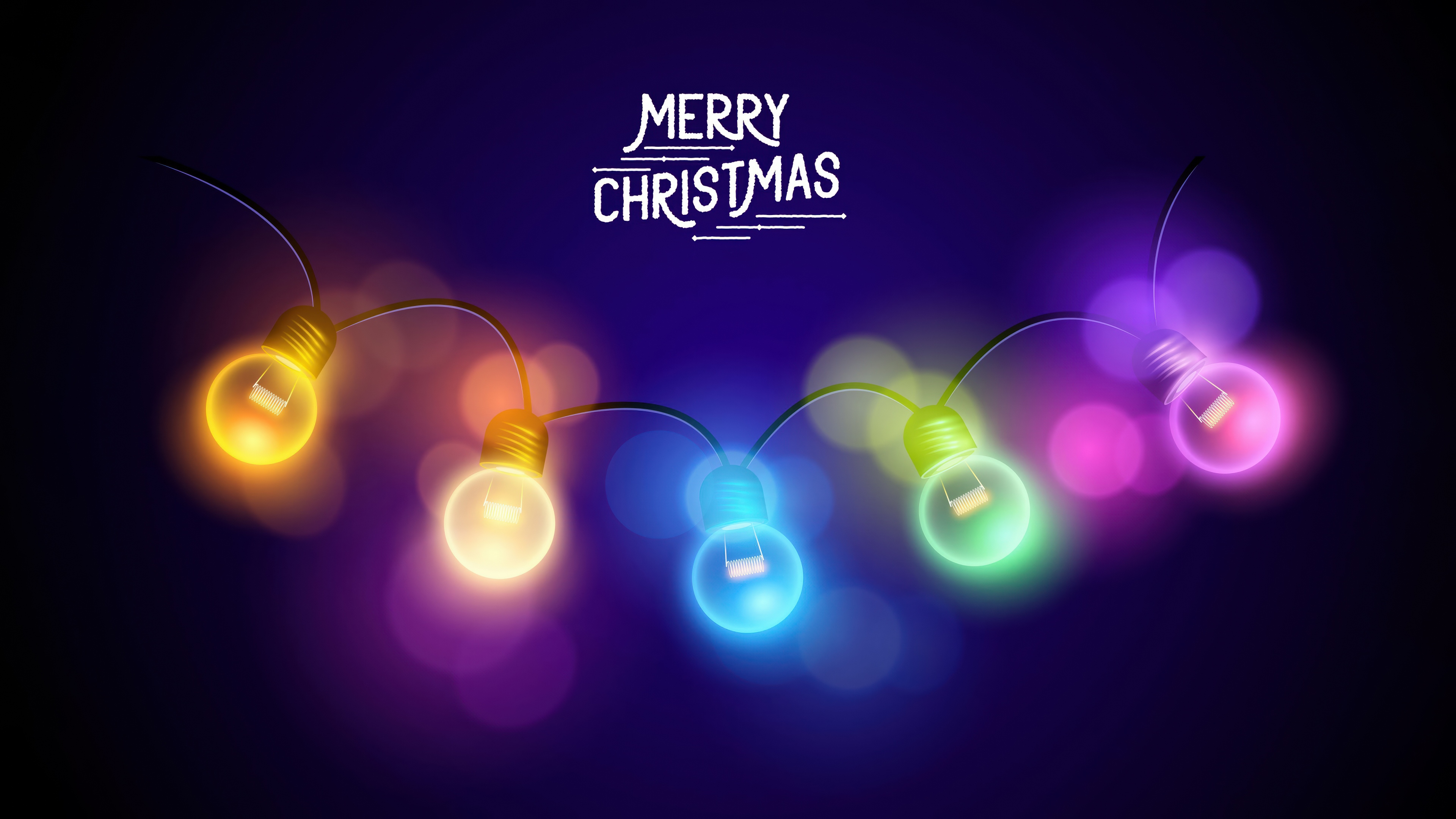 Vibrant colorful Christmas lights with a soft bokeh effect on a dark blue background during the holidays.