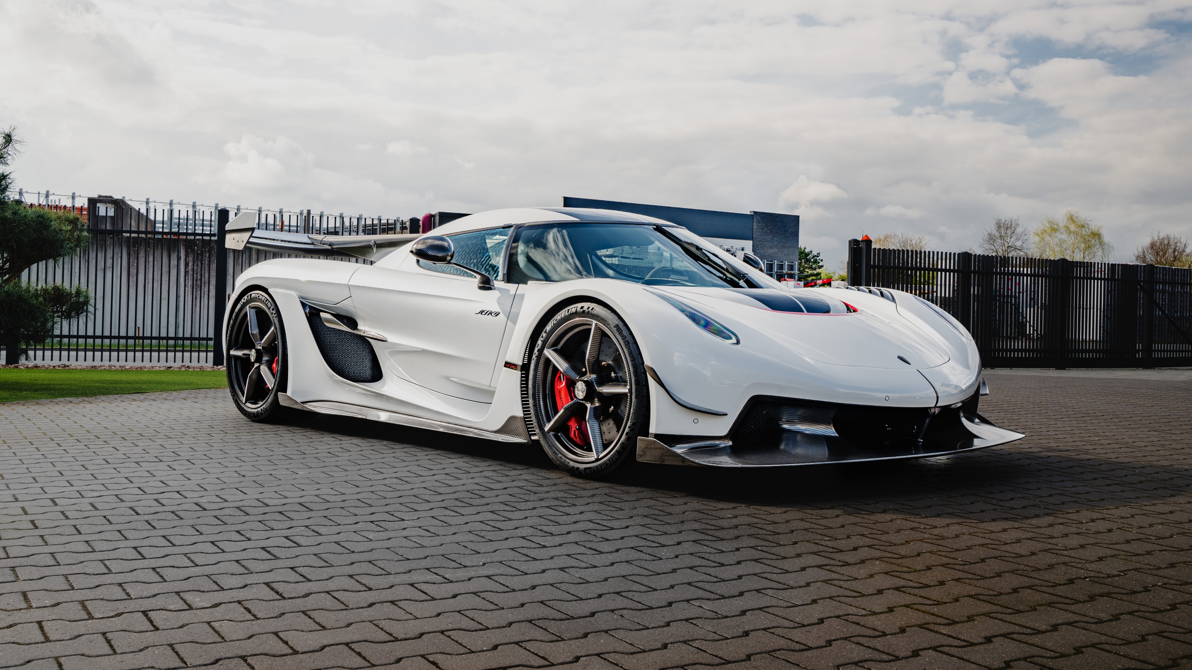 A high-resolution, detailed shot of a white Koenigsegg Jesko hypercar.