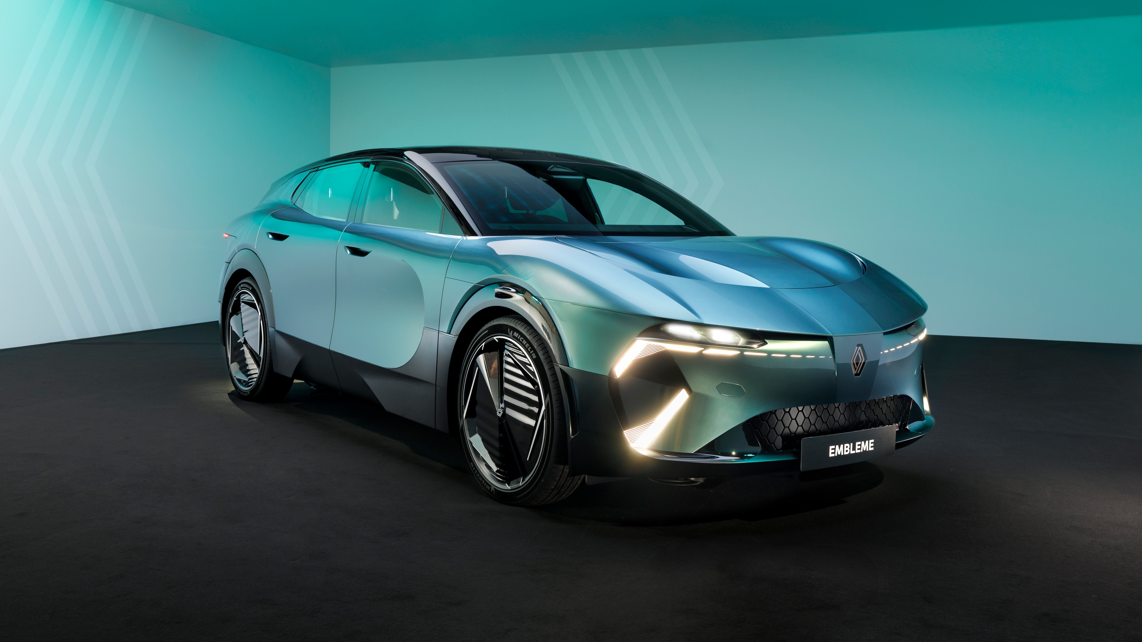 High-tech electric cars driving through a futuristic, clean urban environment under bright, clear lighting.