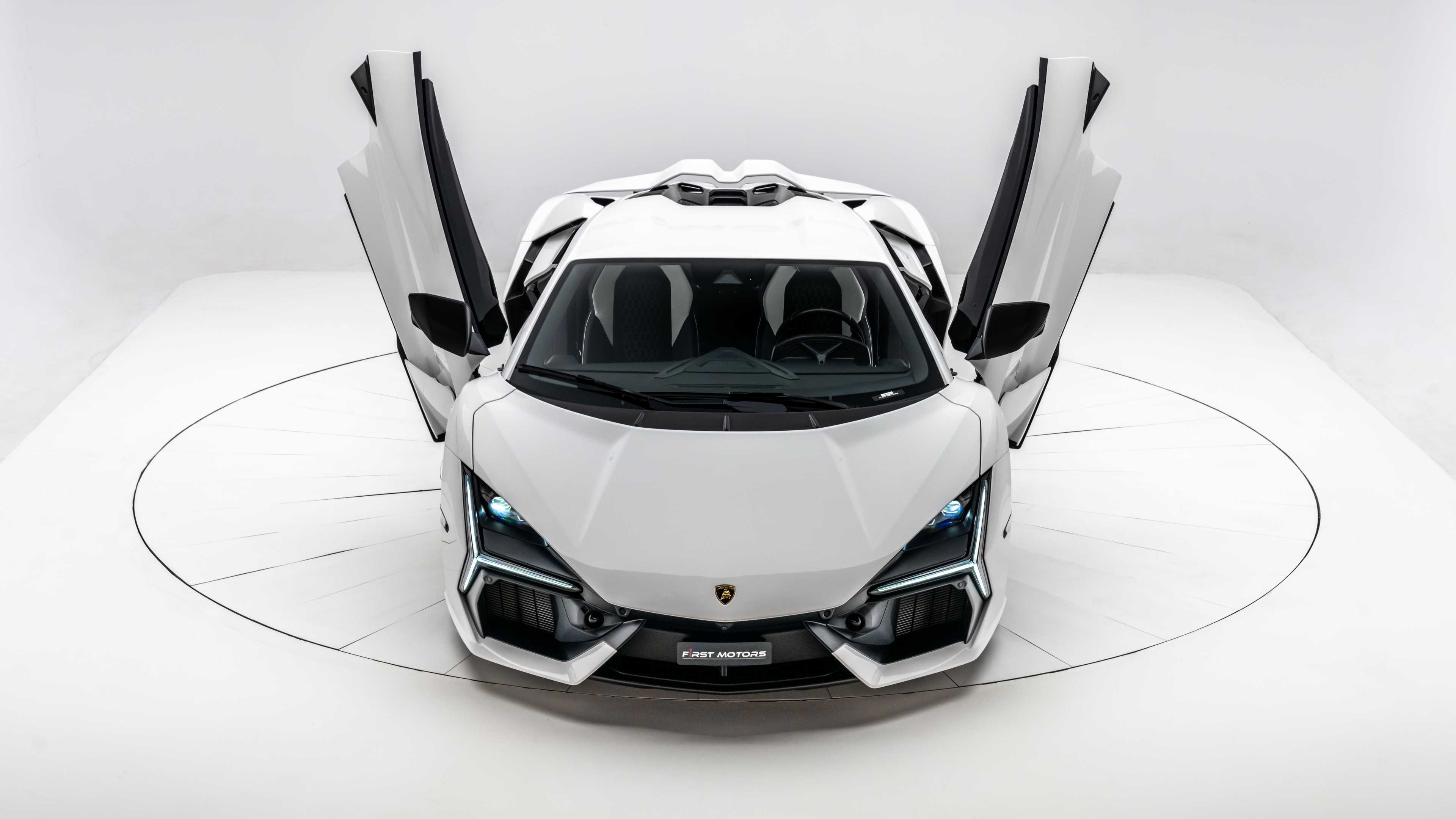 A high-resolution, close-up view of a white Lamborghini Revito supercar with a minimalist white aesthetic.