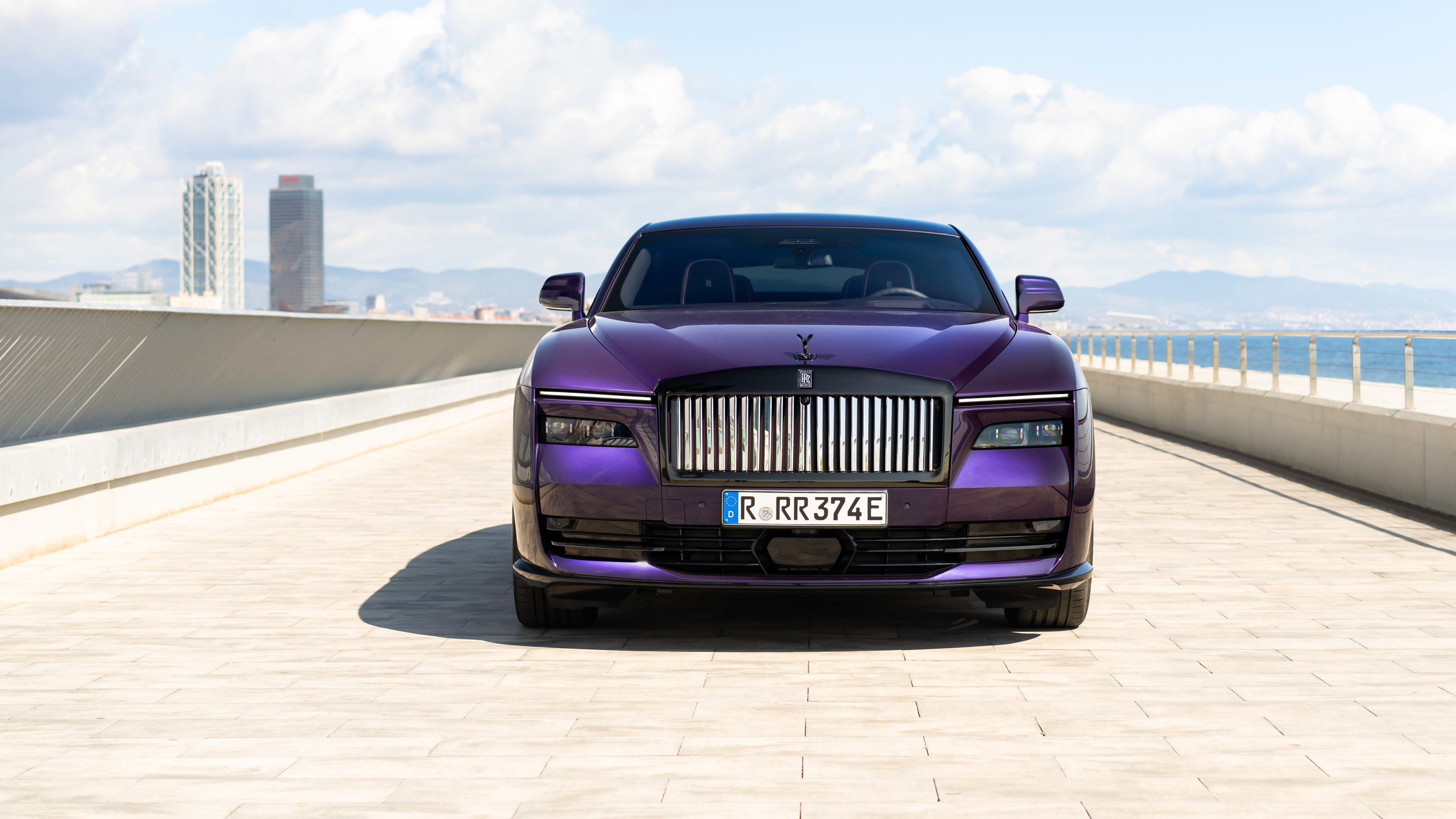A high-resolution, detailed view of the luxurious Rolls-Royce Black Badge Spectre in a deep black finish.
