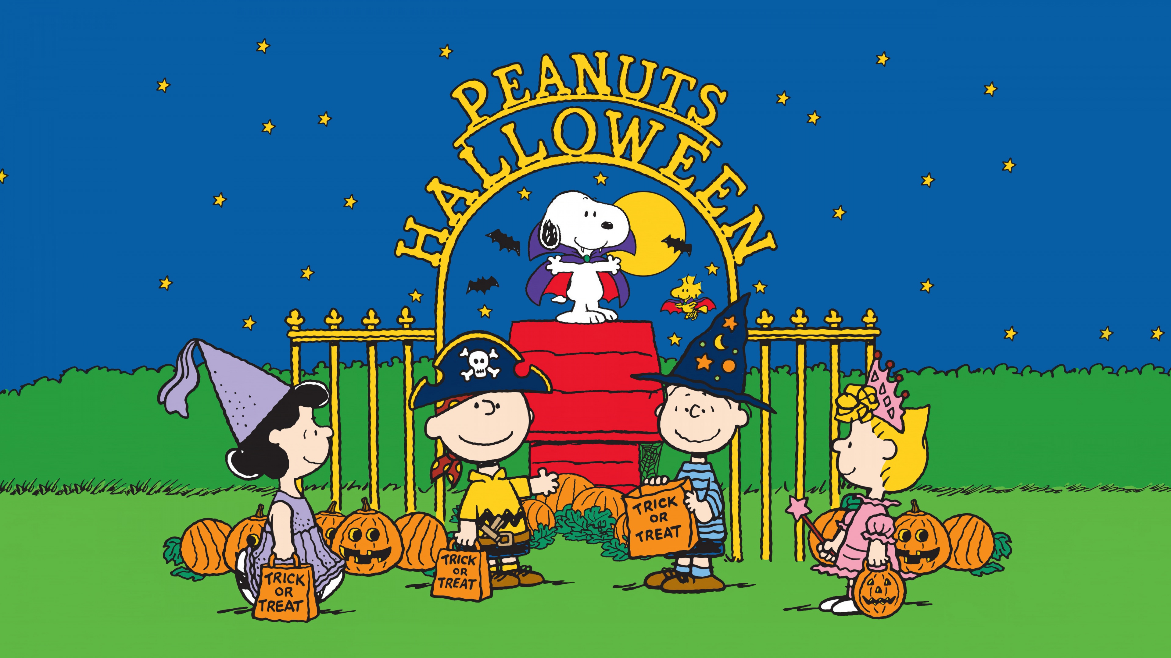 Snoopy and the Peanuts gang celebrating Halloween with pumpkins and trick-or-treat decorations.