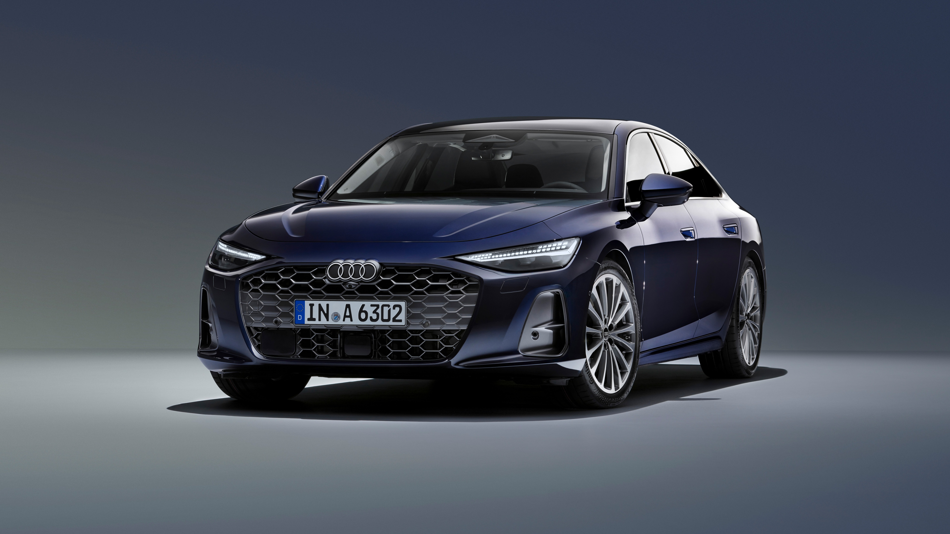 A high-resolution, detailed view of a 2025 Audi A6 TFSI quattro luxury sedan.
