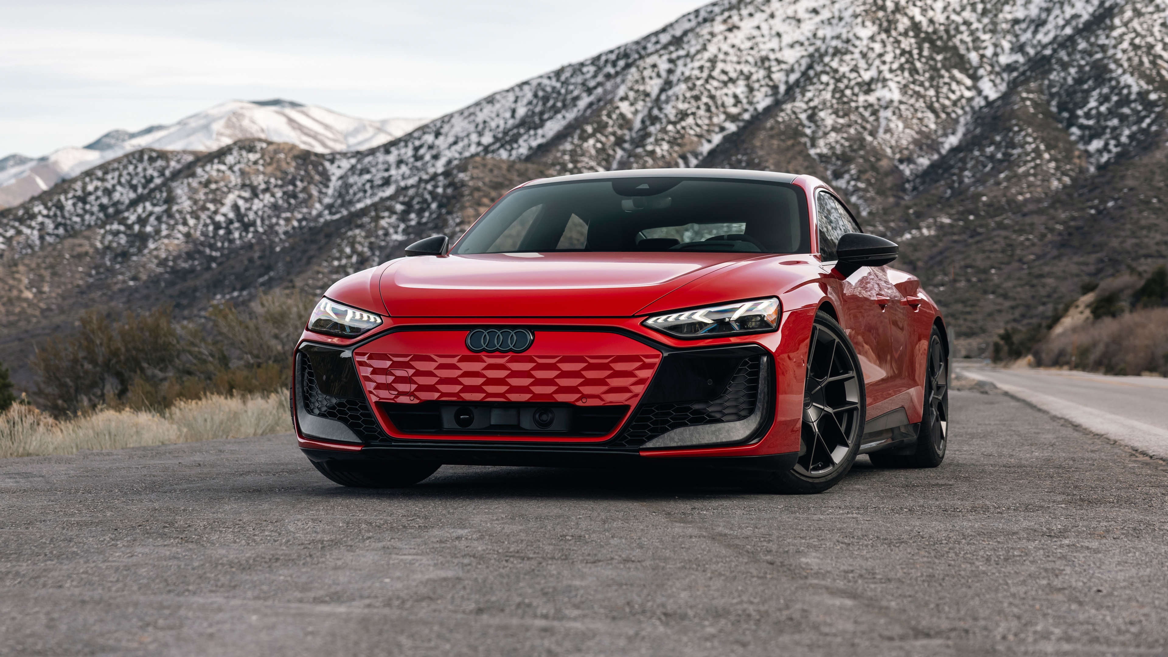 A sleek red 2025 Audi RS e-tron GT performance luxury electric car.