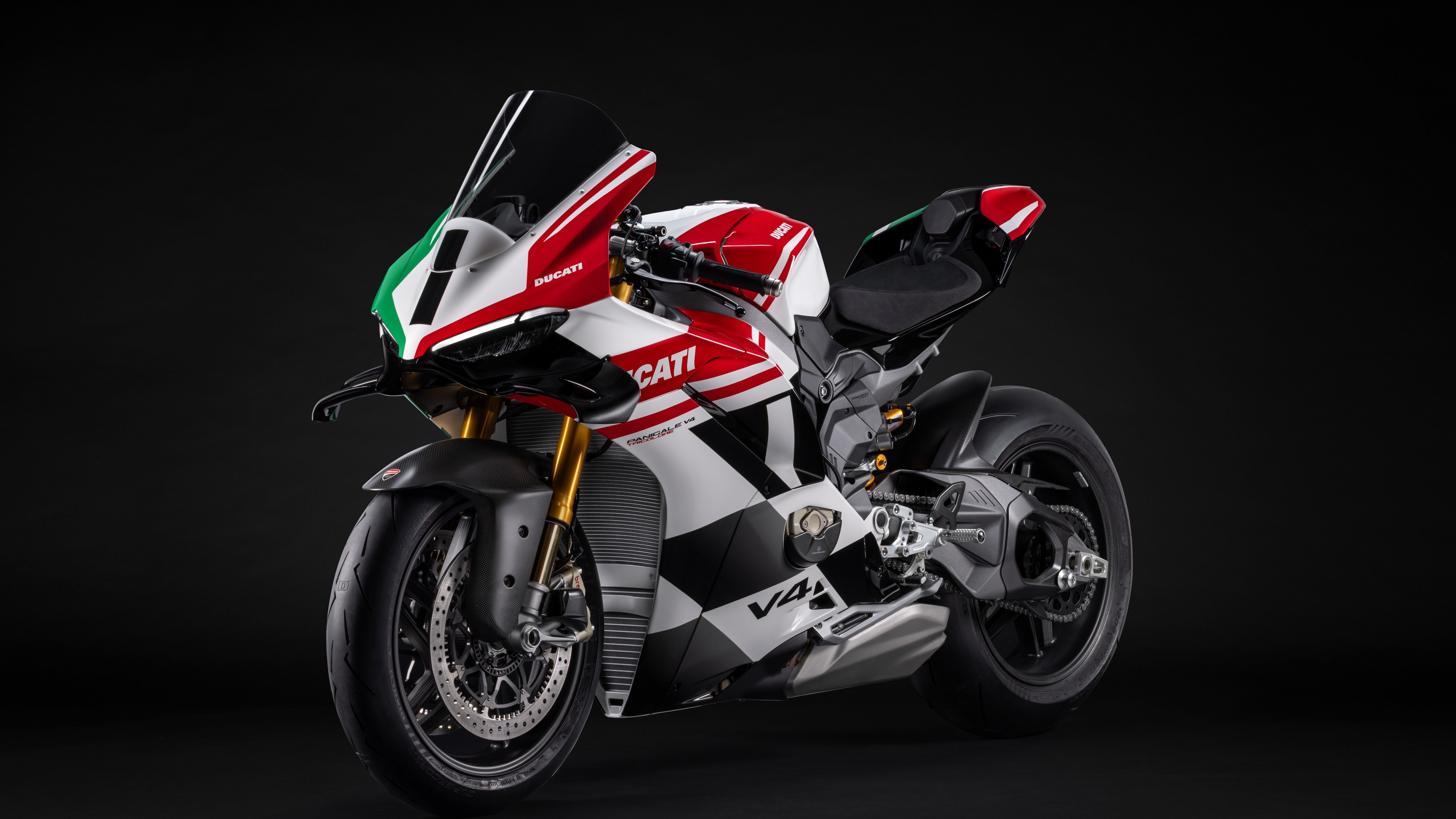 A high-detail, cinematic shot of the 2025 Ducati Panigale V4 Tricolore sports bike against a dark, moody background.