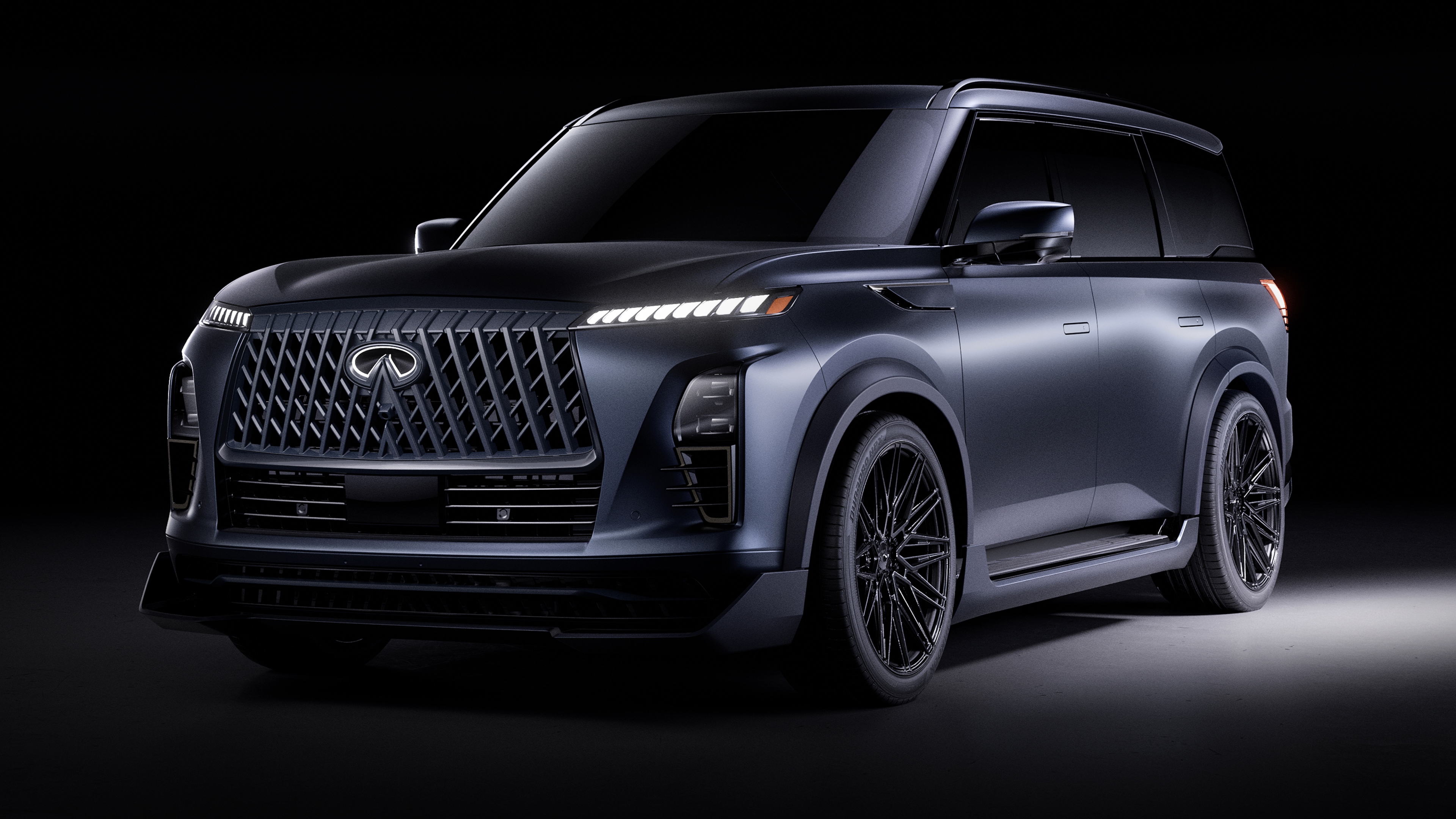 A high-resolution, cinematic view of a dark, futuristic performance SUV against a black background.
