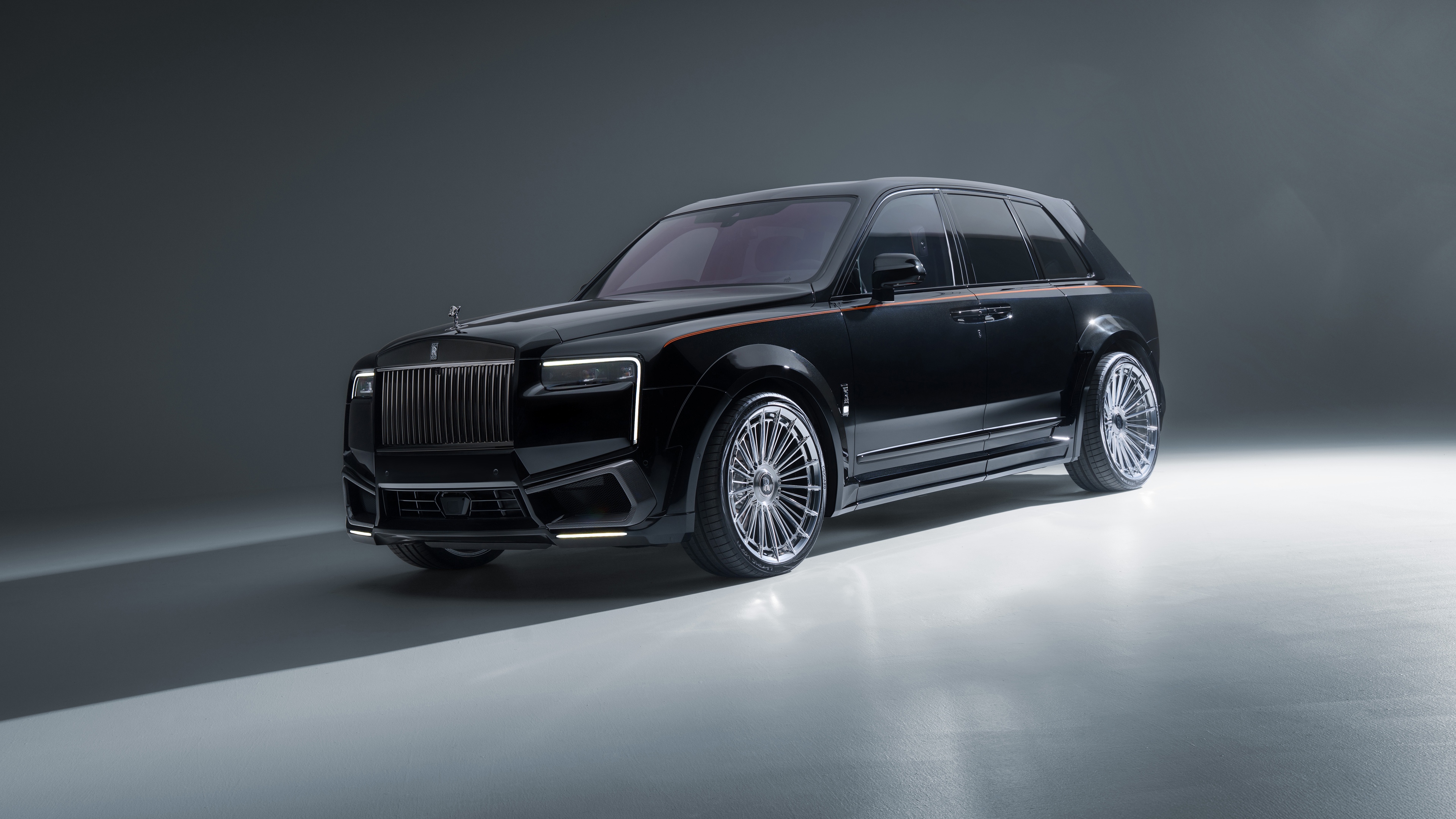 A high-resolution, detailed view of a luxurious black 2025 Rolls-Royce Cullinan SUV.