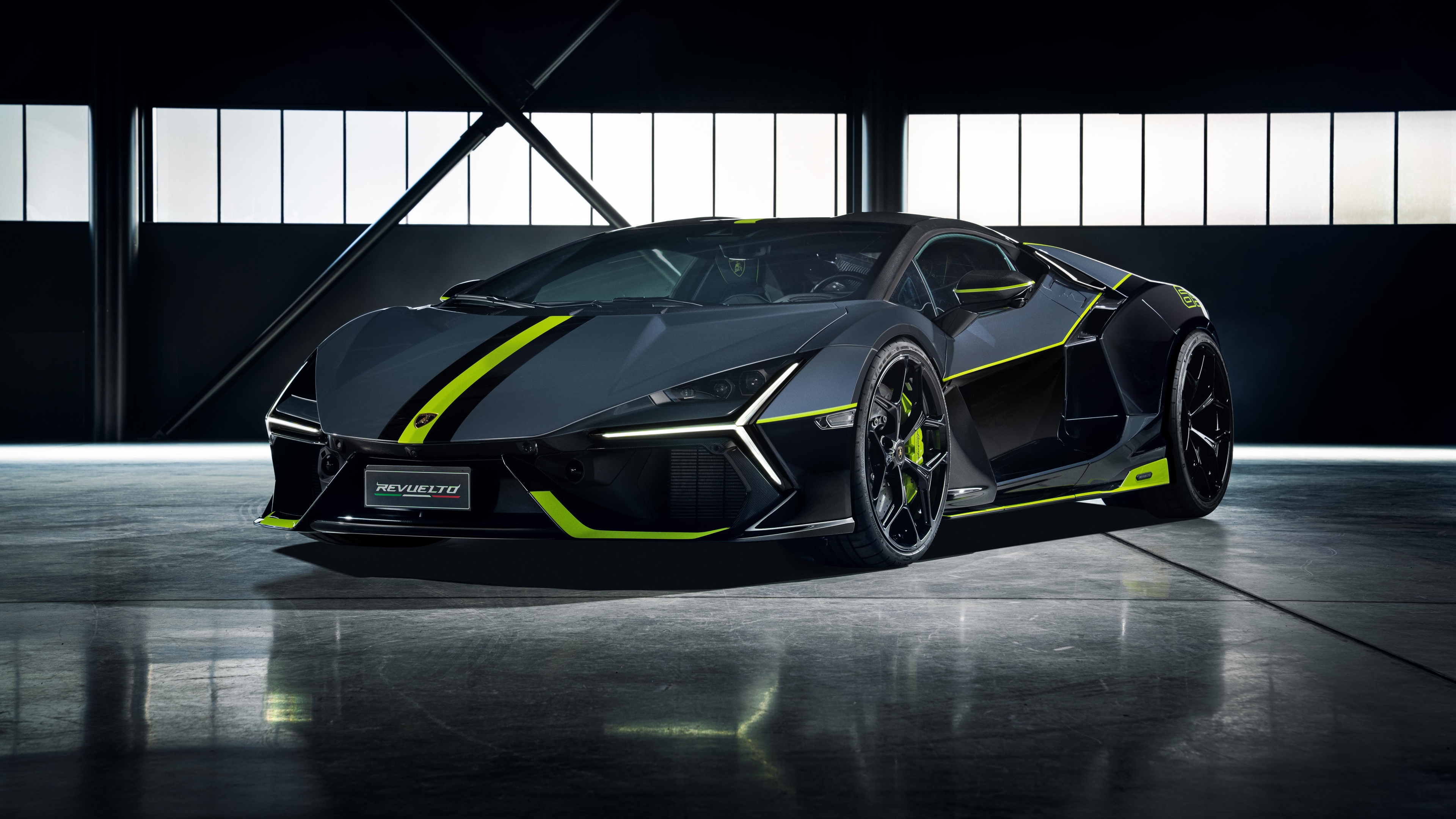 A high-detail, dark aesthetic shot featuring a Ducati motorcycle and a Lamborghini Revuelto supercar.