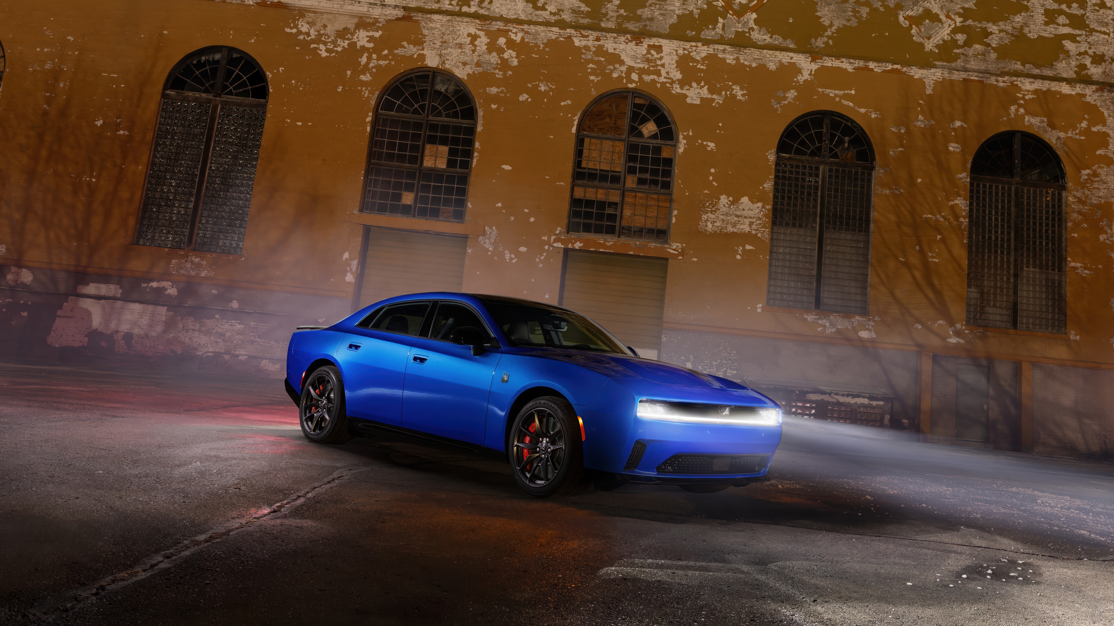 A high-performance Dodge Charger Daytona Scat Pack muscle car displaying aggressive automotive design.