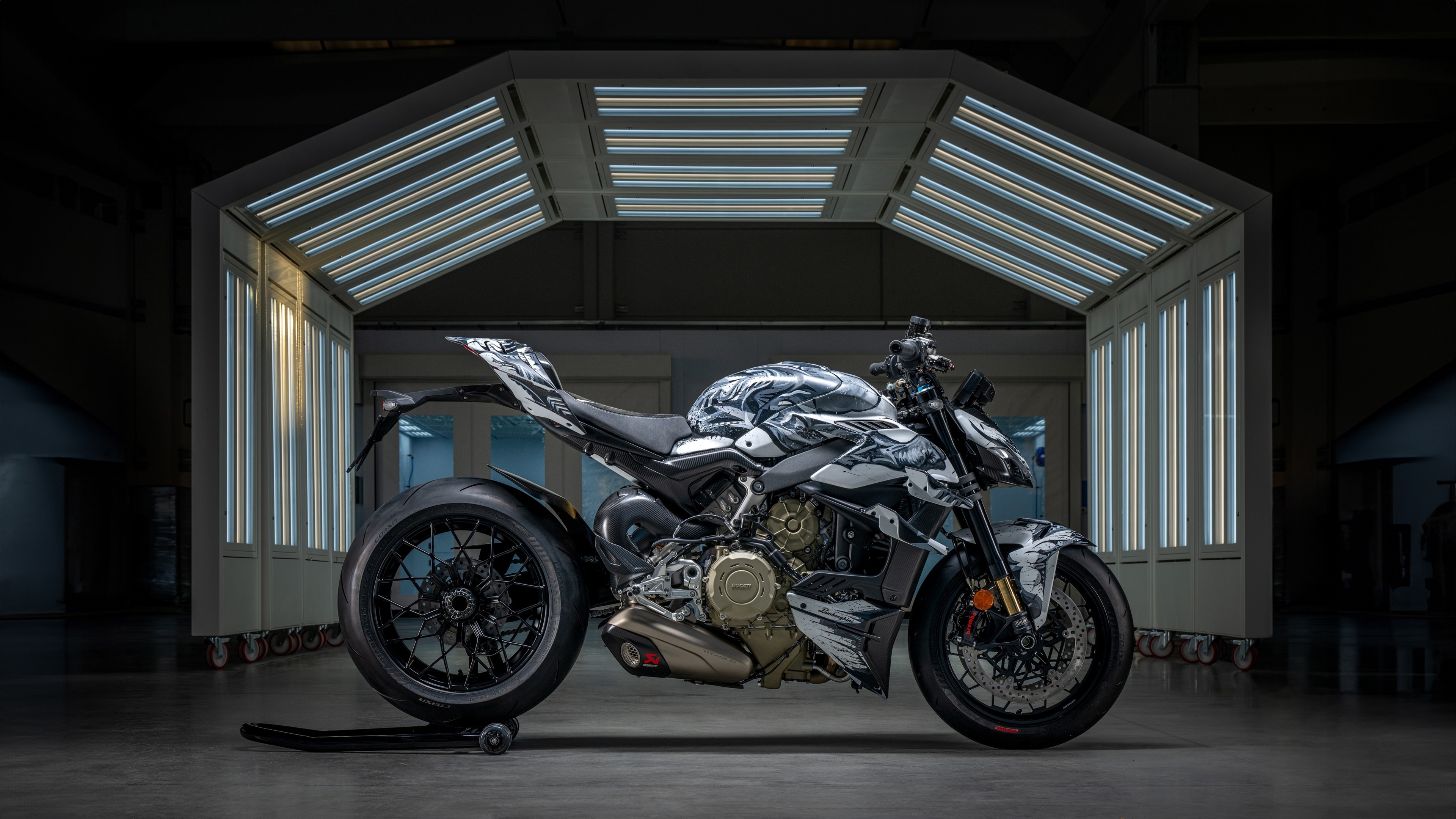 A high-resolution, detailed view of a Ducati Streetfighter V4 motorcycle featuring a custom Lamborghini-style paint scheme and aerodynamic accents.