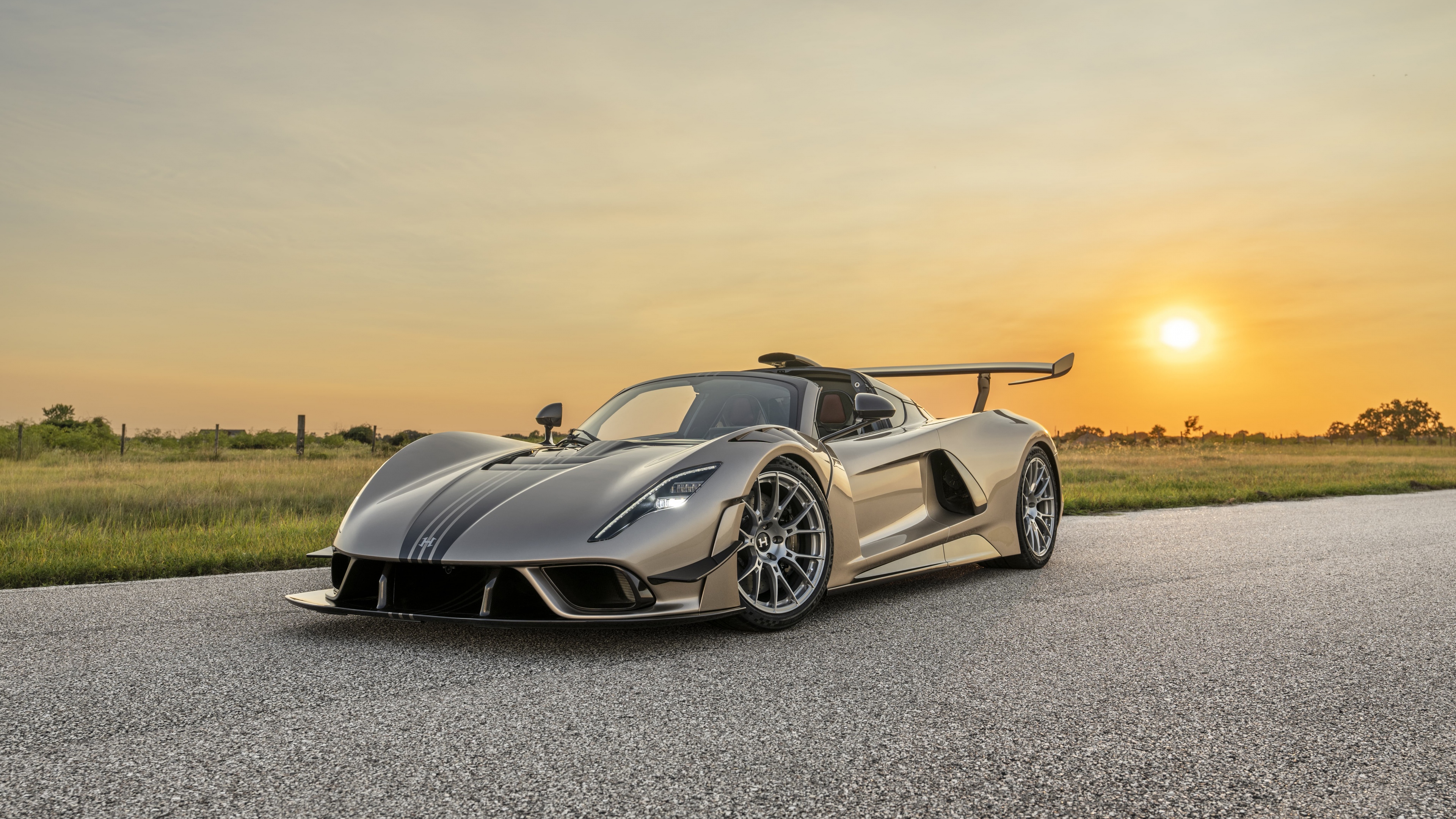 A detailed, cinematic view of the Hennessey Venom F5 Revolution hypercar, showcasing its aerodynamic body and high-performance design.