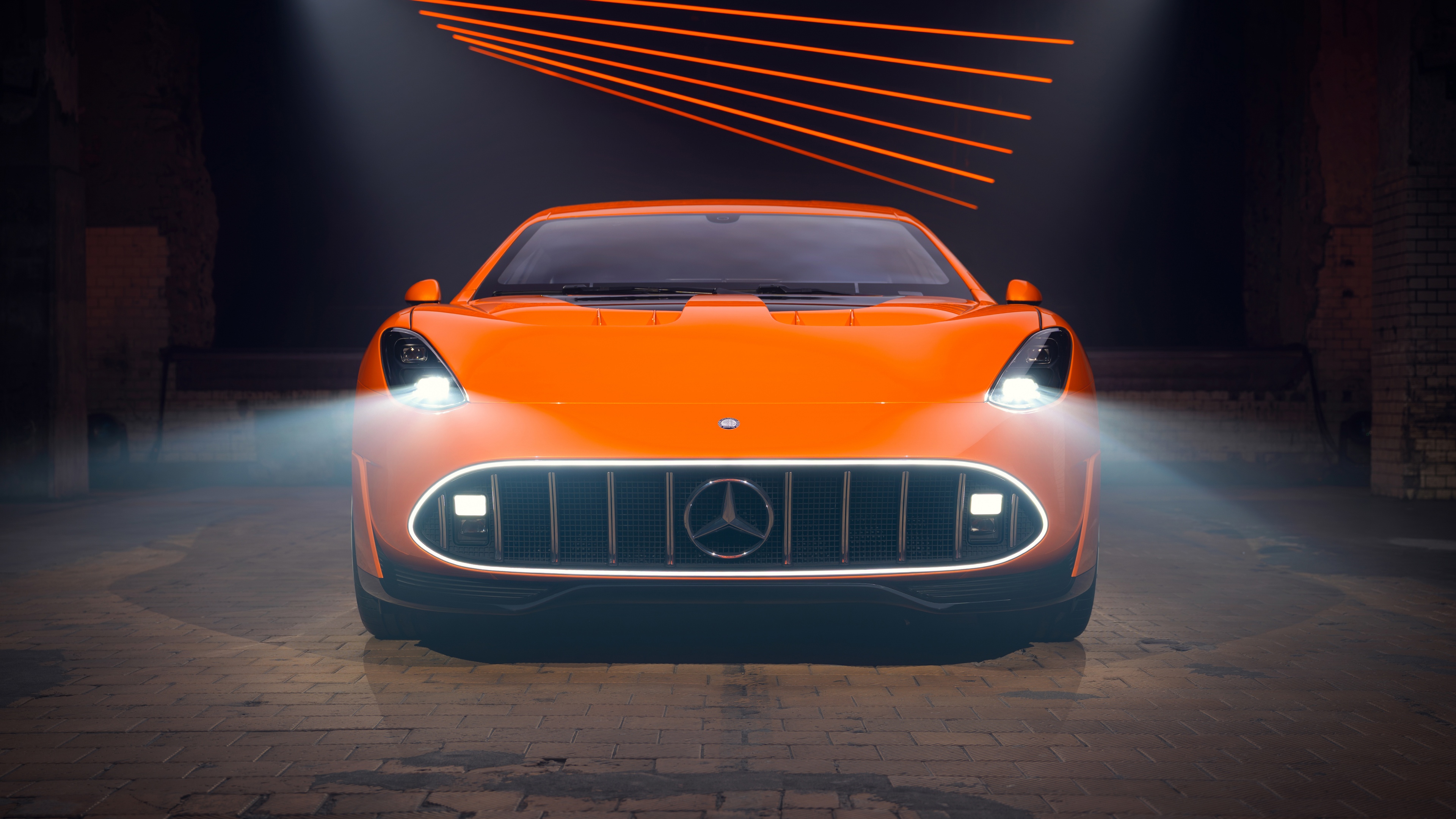Close-up view of the futuristic headlights and front grille of the Mercedes-AMG GT XX concept car.
