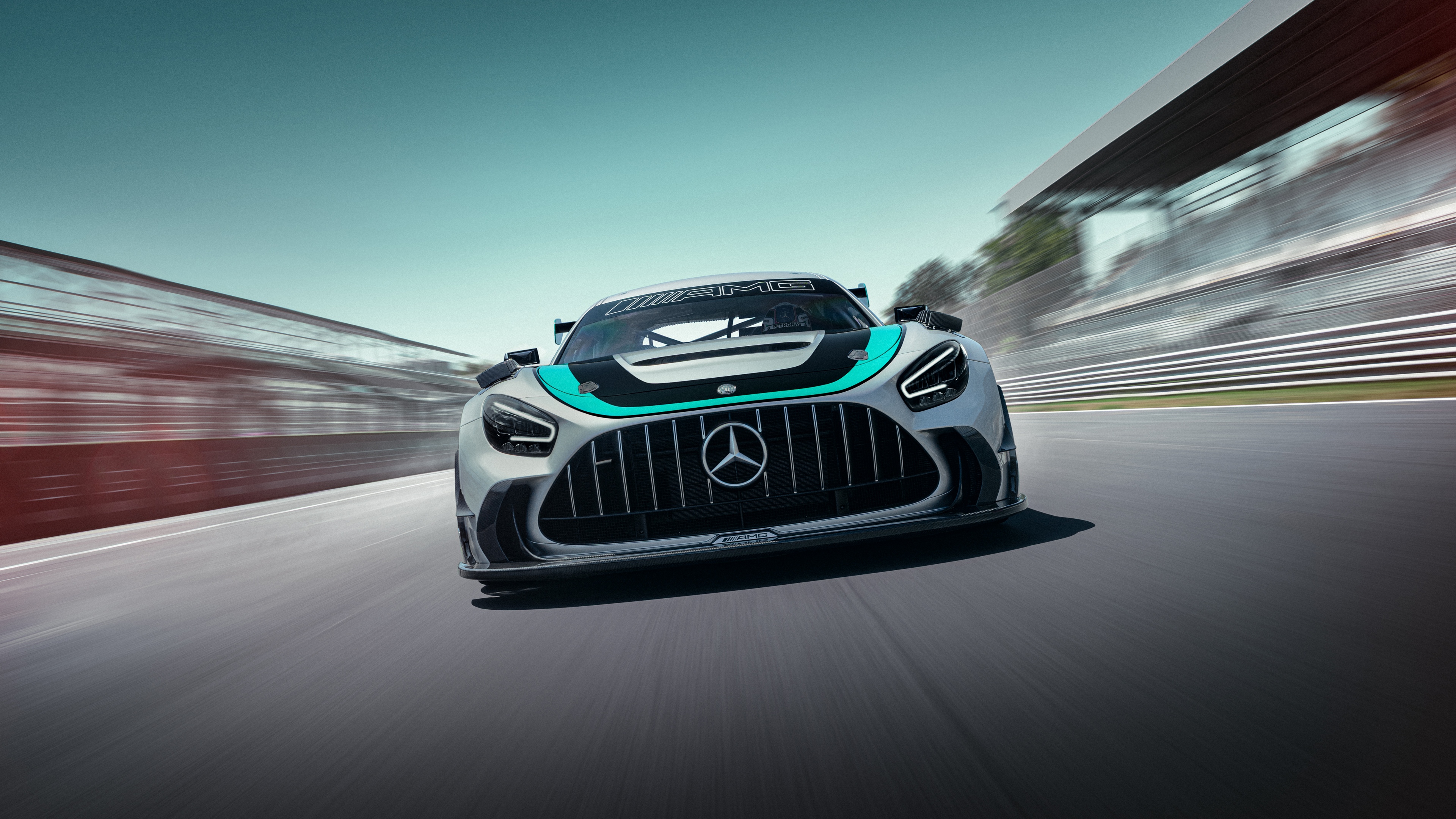 A high-performance Mercedes-AMG GT2 Edition W16 racing on a professional circuit.