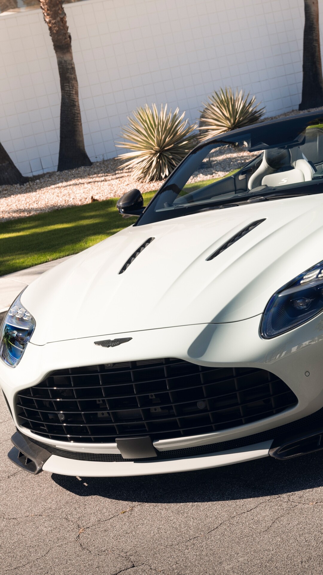 A high-resolution, detailed view of a luxury Aston Martin DB12 S Volante convertible featuring sleek aerodynamic lines.