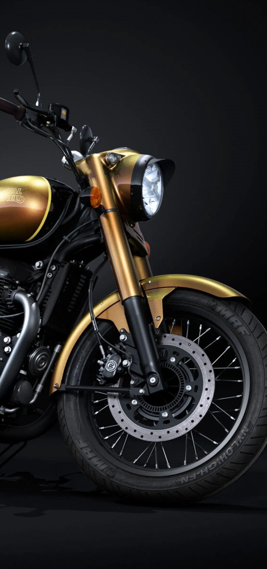 Anniversary Edition motorcycle displayed at the 2025 EICMA Motorcycle Show under dramatic dark lighting.