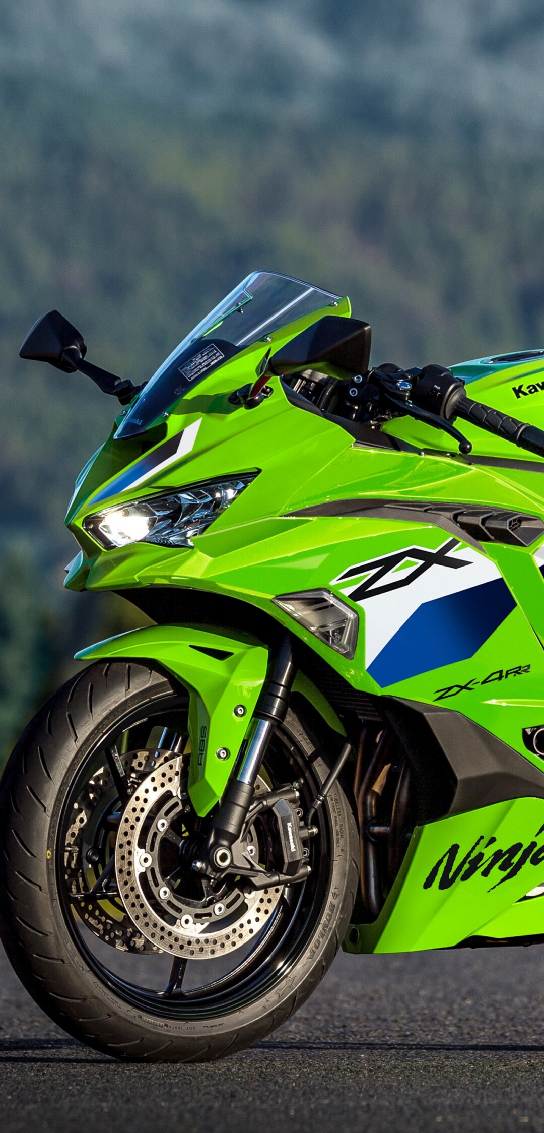 A sleek and futuristic 2026 Kawasaki Ninja ZX-4RR motorcycle featuring signature lime green and black racing livery.