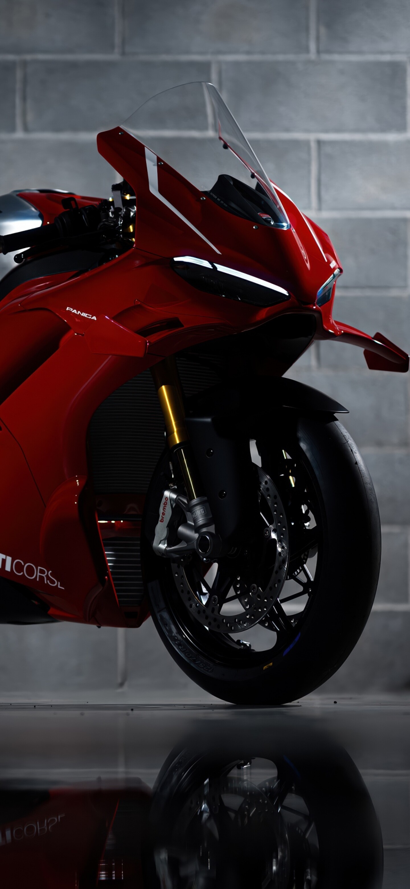 A sleek, red 2026 Ducati Panigale V4 R performance motorcycle with aerodynamic bodywork.