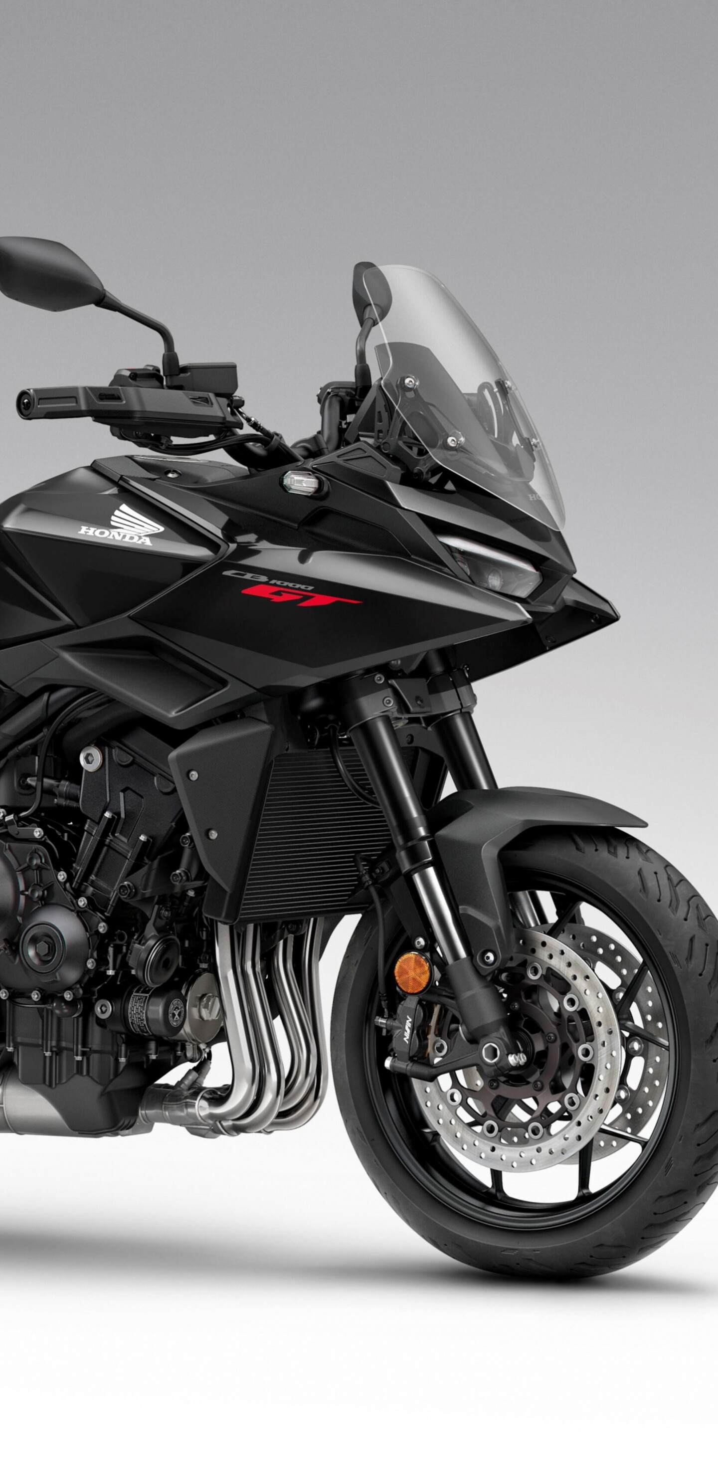 A sleek and modern black 2026 Honda CB1000GT touring motorcycle with a glossy finish.
