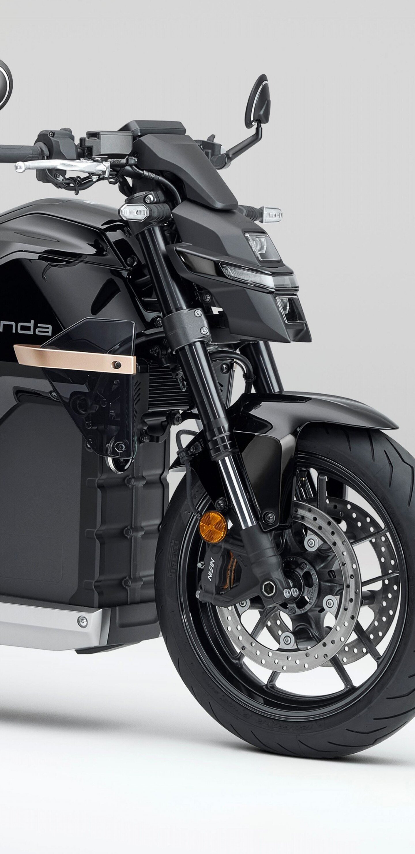 Close-up shot of the Honda WN7 electric motorcycle showcased at the EICMA Motorcycle Show.