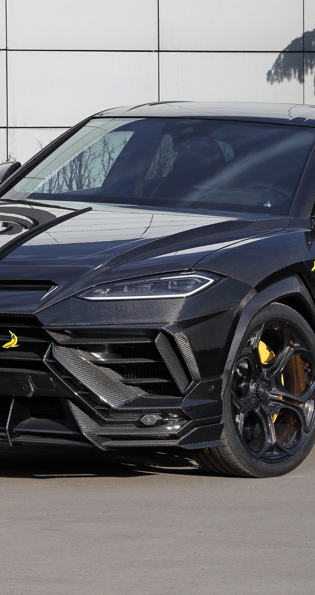 A highly detailed 5K close-up of a customized Lamborghini Urus SE featuring TopCar Design widebody elements and premium finishes.