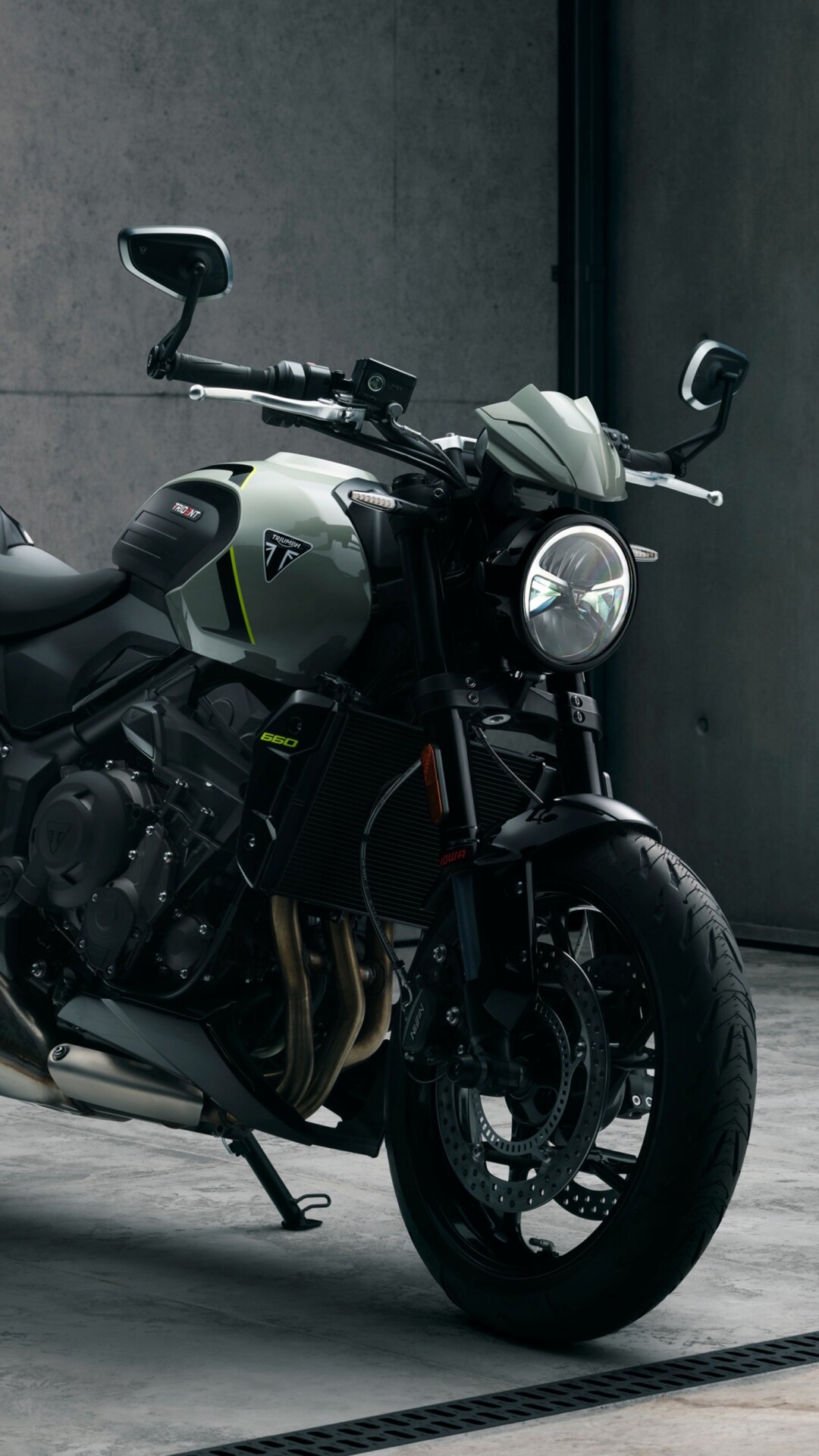 A muscular black Triumph Trident 660 street motorcycle with a sleek, modern design.