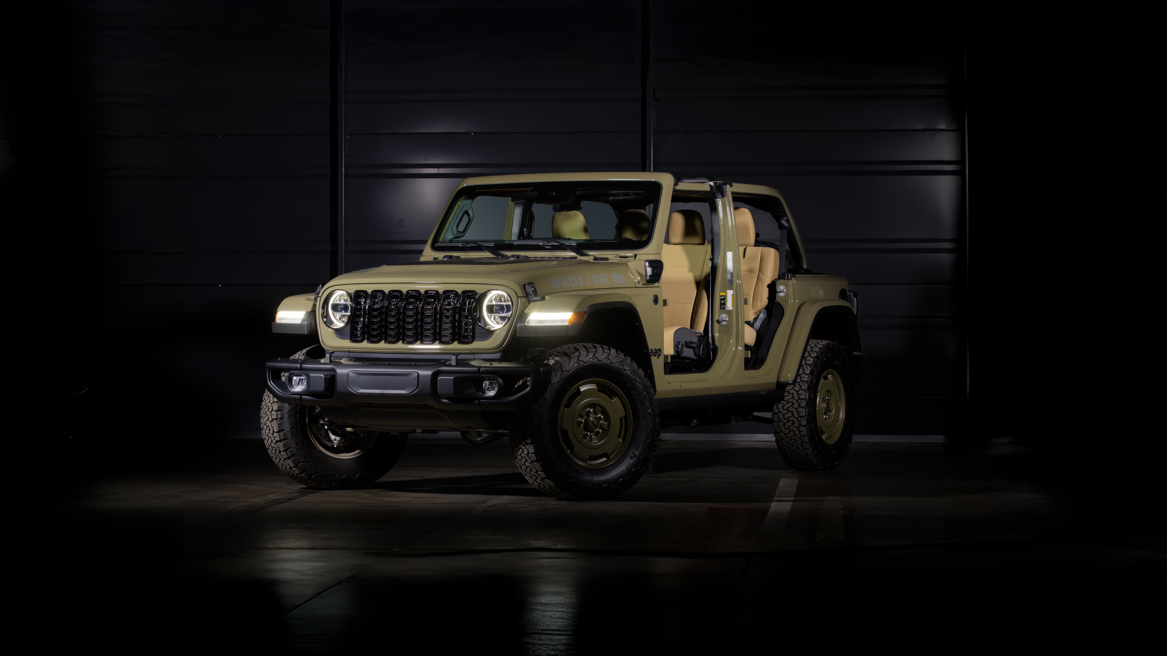 A high-resolution 5K image of a 2025 Jeep Wrangler Unlimited positioned against a dark, minimalist background.