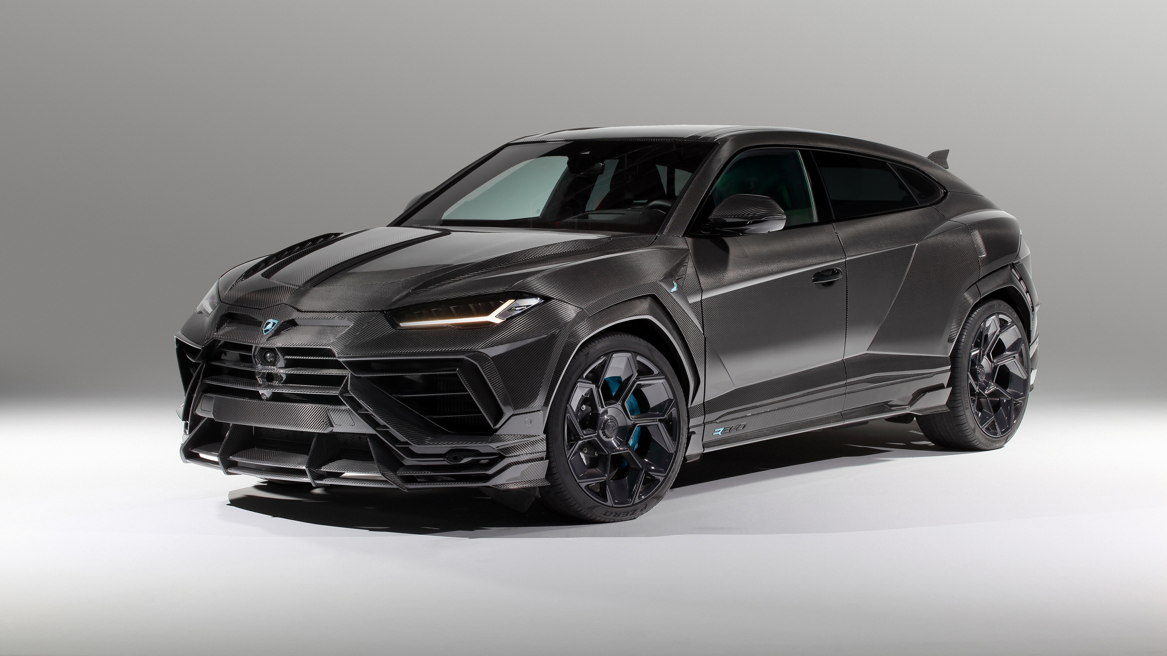 A high-detail, 5K resolution shot of the 2024 Lamborghini Urus R'Evo luxury supercar SUV.