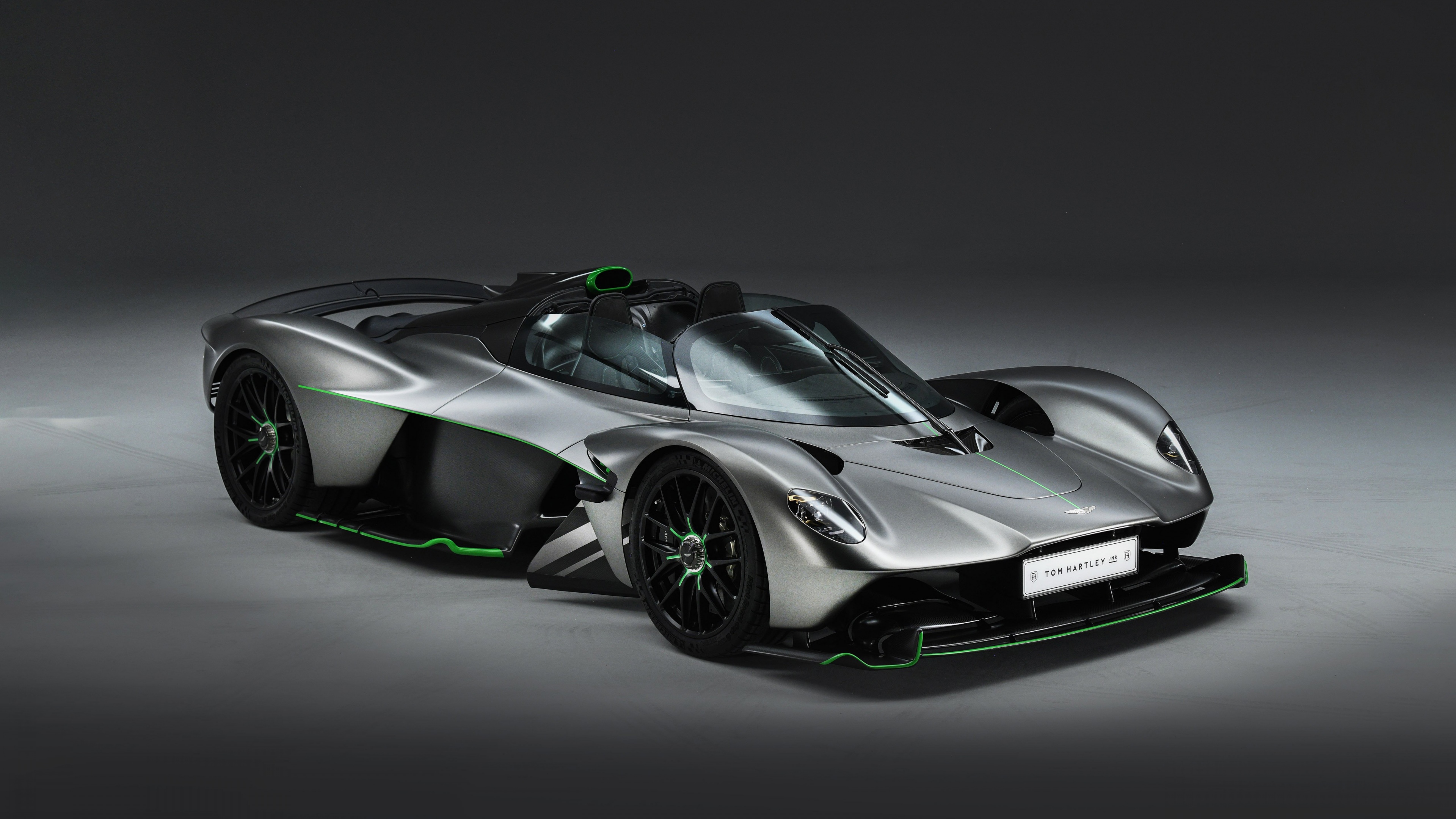 A high-resolution view of the 2025 Aston Martin Valkyrie Spider hypercar, highlighting its aerodynamic curves and luxury design.