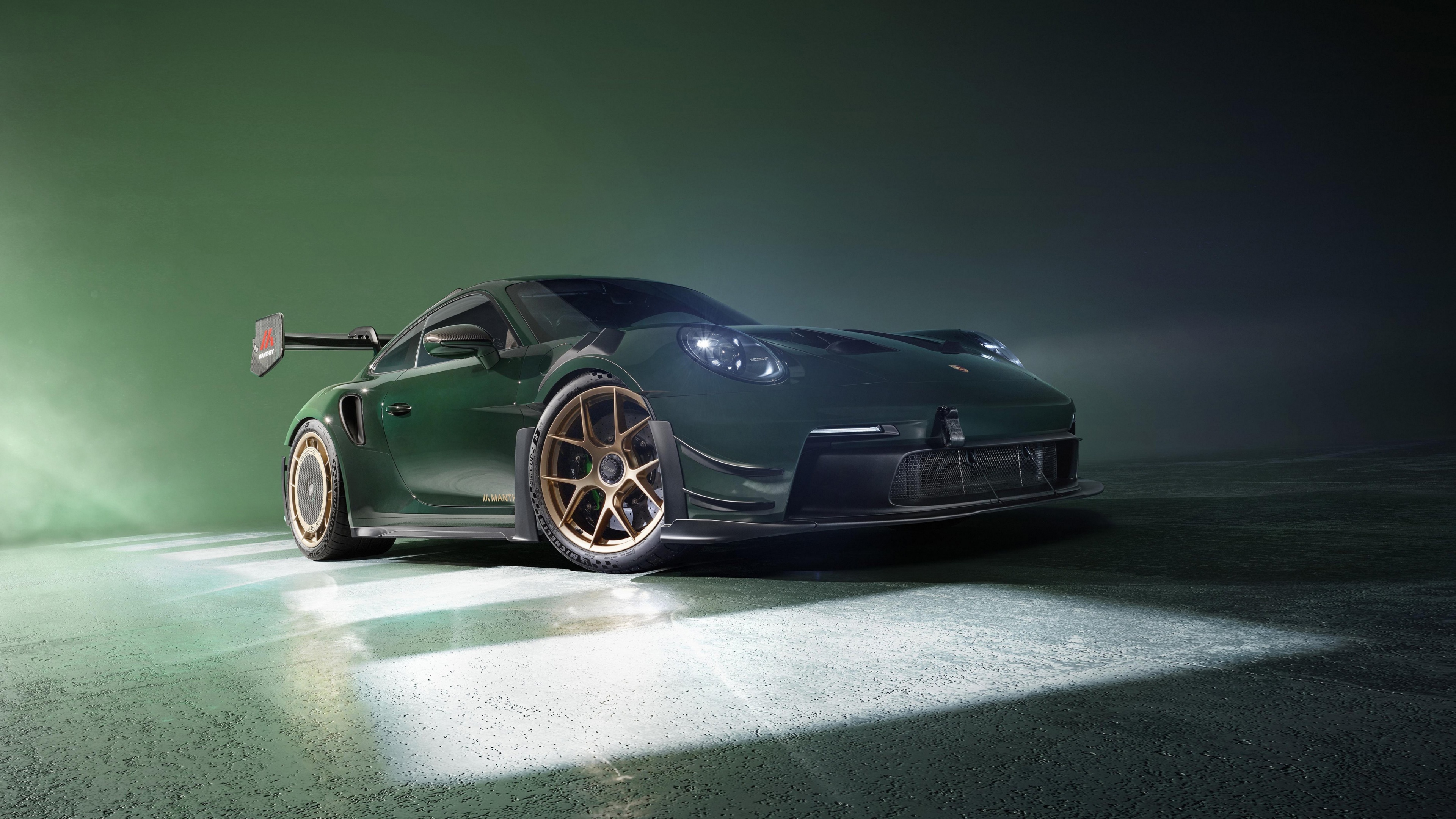 A high-resolution cinematic shot of a Porsche 911 GT3 RS featuring a vibrant green aesthetic and sleek aerodynamic lines.