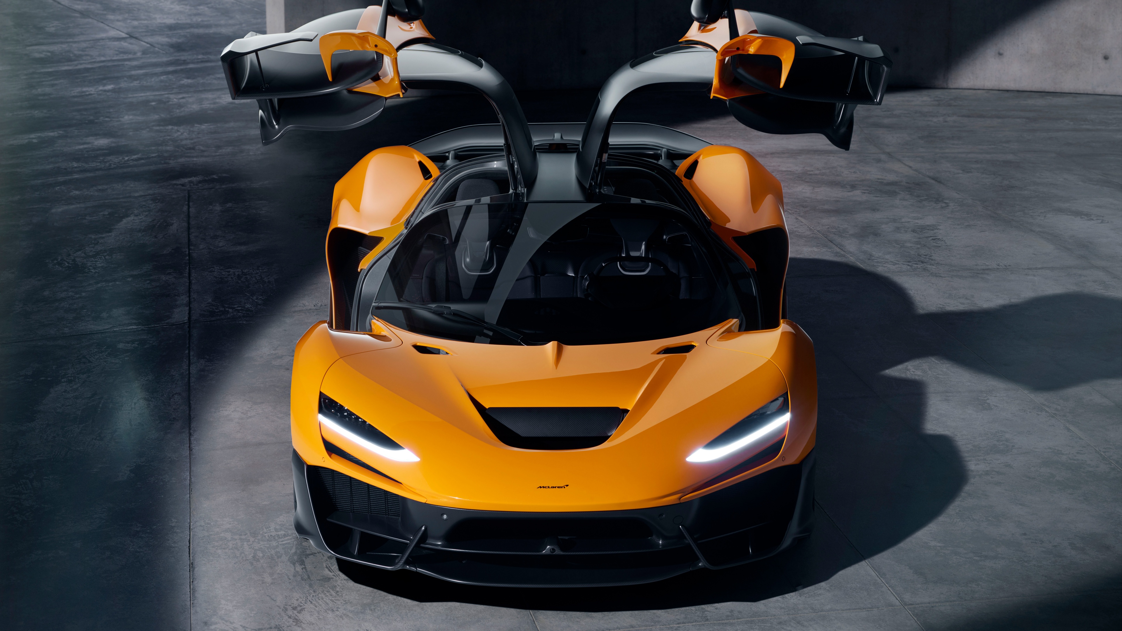 A highly detailed view of the 2024 McLaren W1 supercar featuring sleek aerodynamic lines and futuristic automotive design.