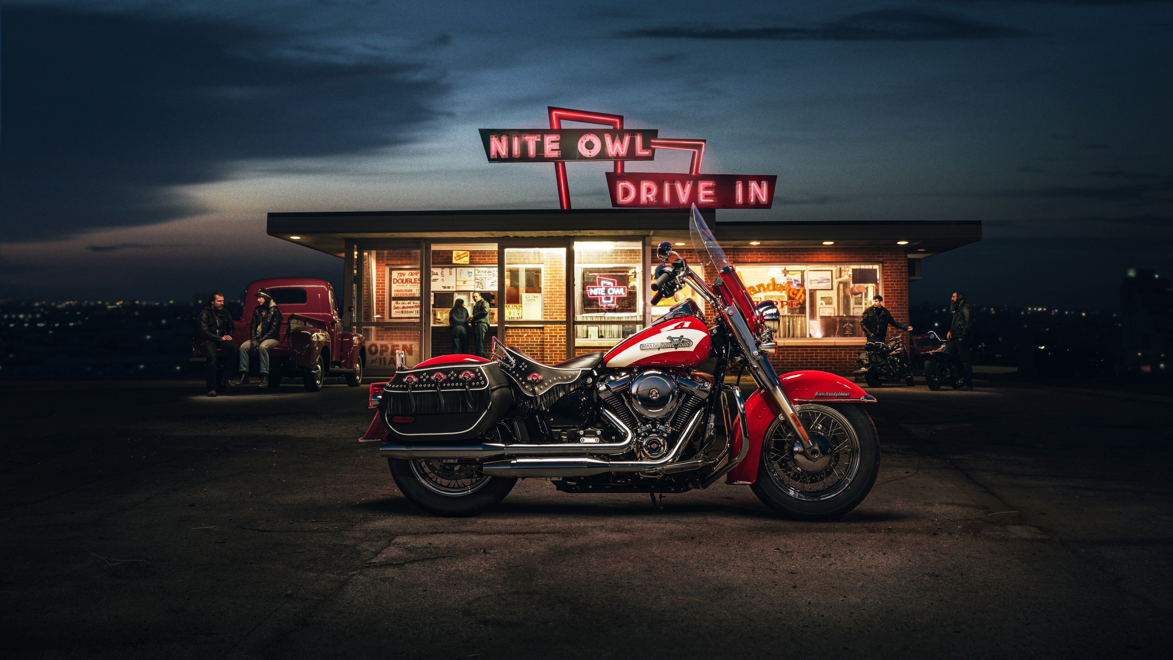A highly detailed view of a classic Harley-Davidson Hydra-Glide motorcycle at night, focusing on its chrome finish and vintage design.