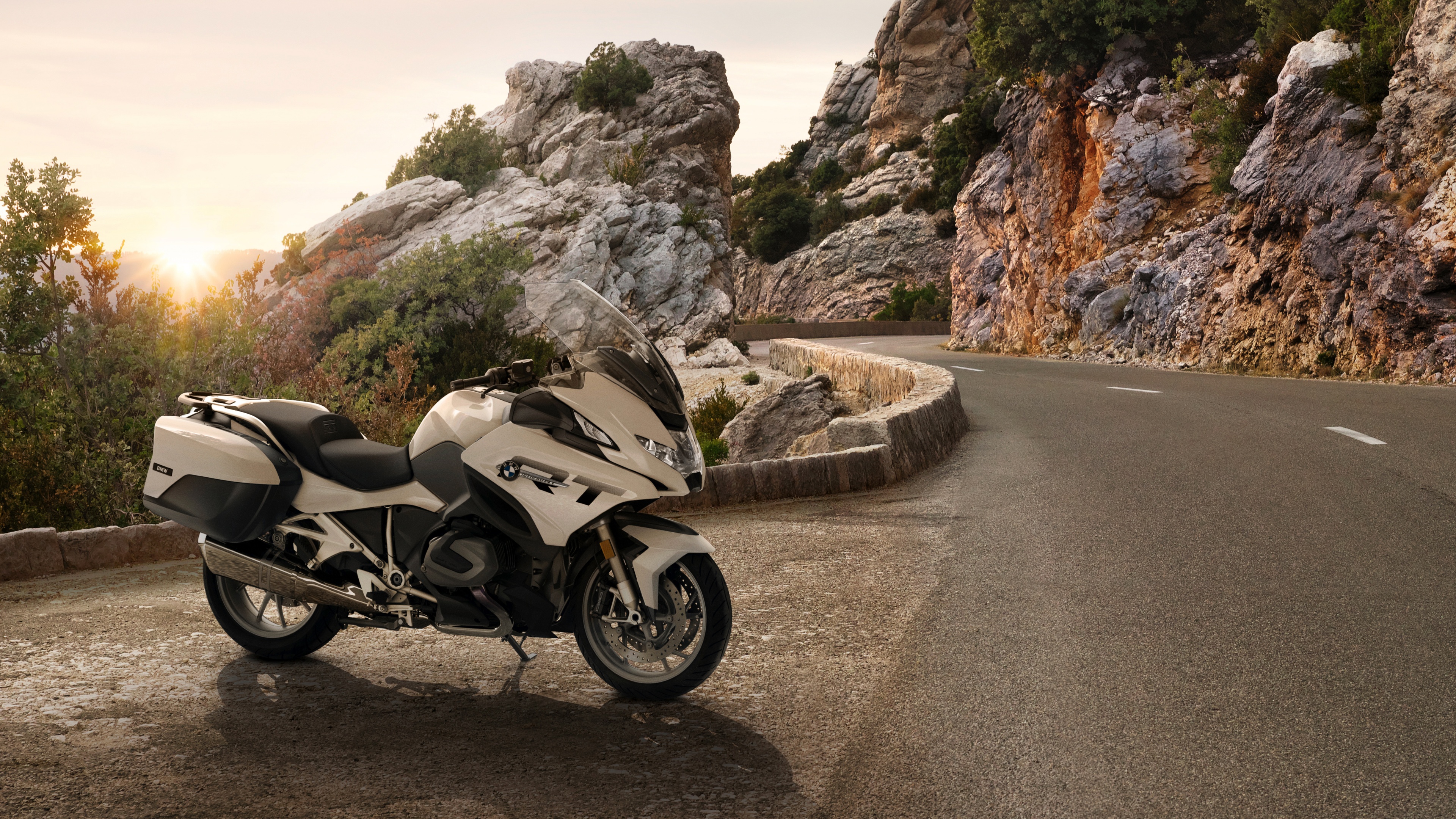 A high-resolution close-up of a modern 2024 touring motorcycle with premium finishes and aerodynamic bodywork.