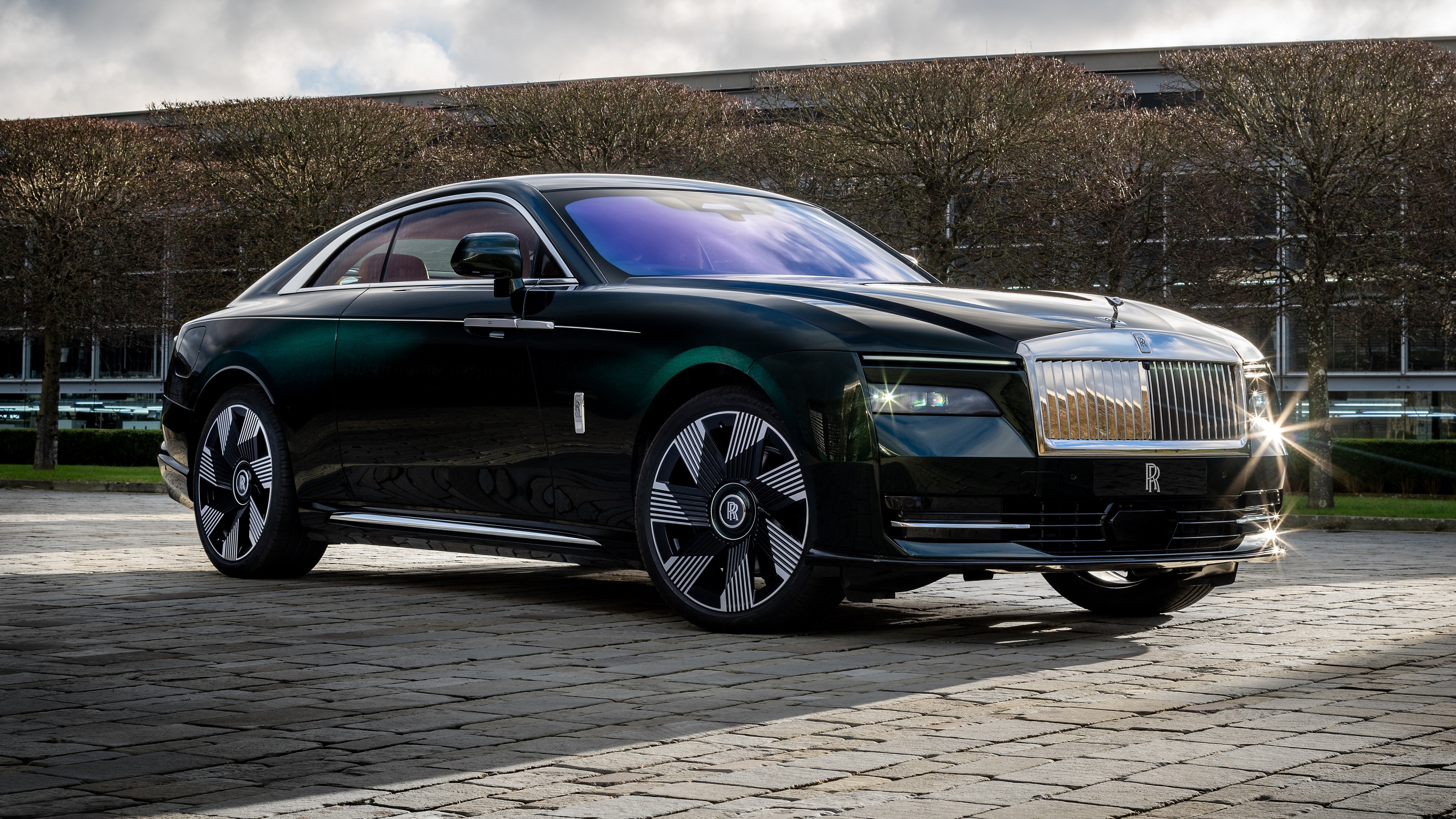 A high-detail, cinematic view of the 2025 Rolls-Royce Spectre luxury electric car.