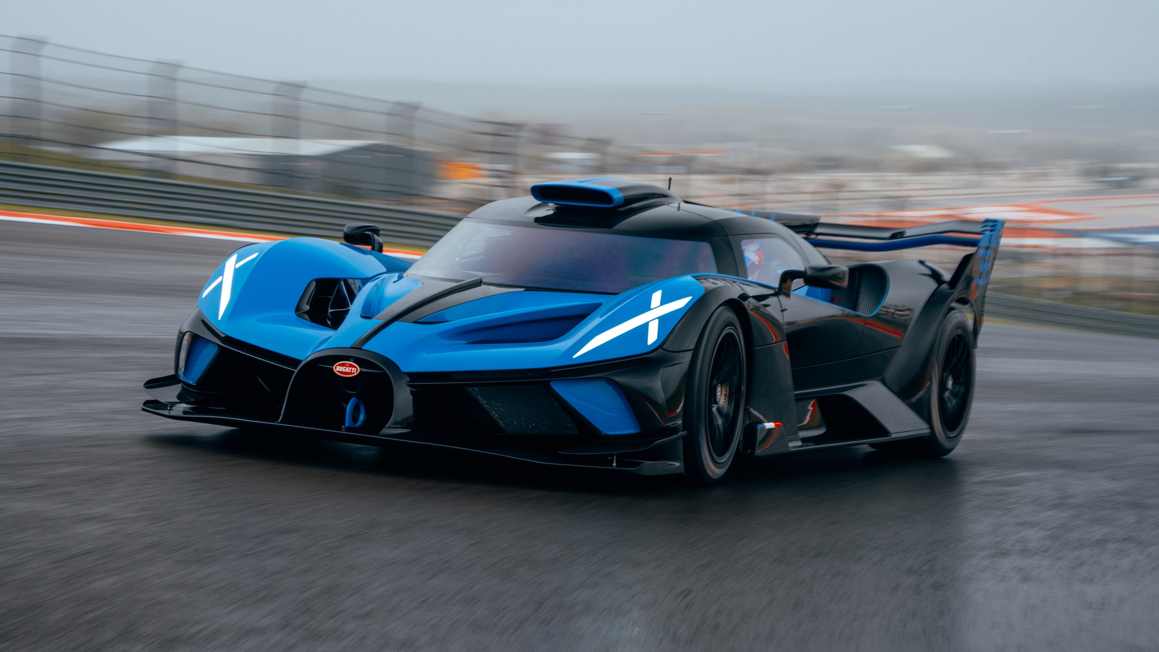 High-resolution detailed shot of the Bugatti Bolide hypercar showcasing its aerodynamic design and aggressive racing features.