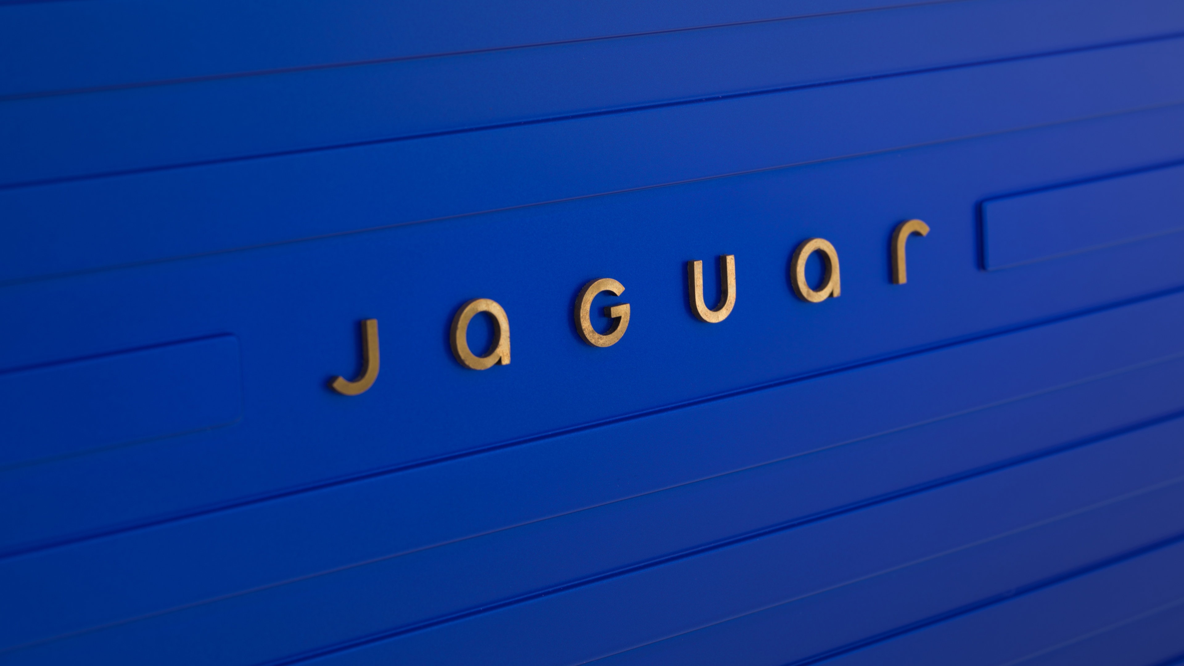 A minimalist and sophisticated jaguar logo in shades of French Ultramarine blue.